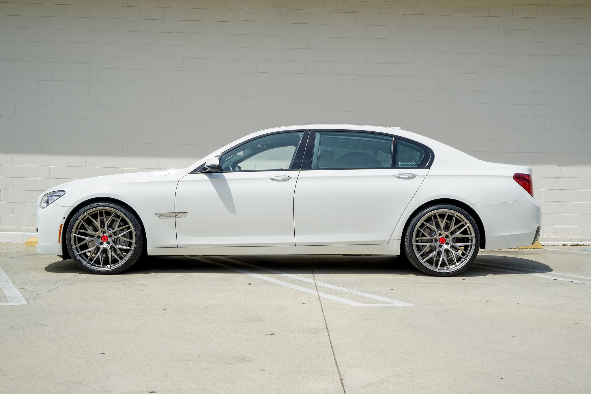 White BMW 7-Series with Chrome Vorsteiner Wheels - Photo by Vorsteiner