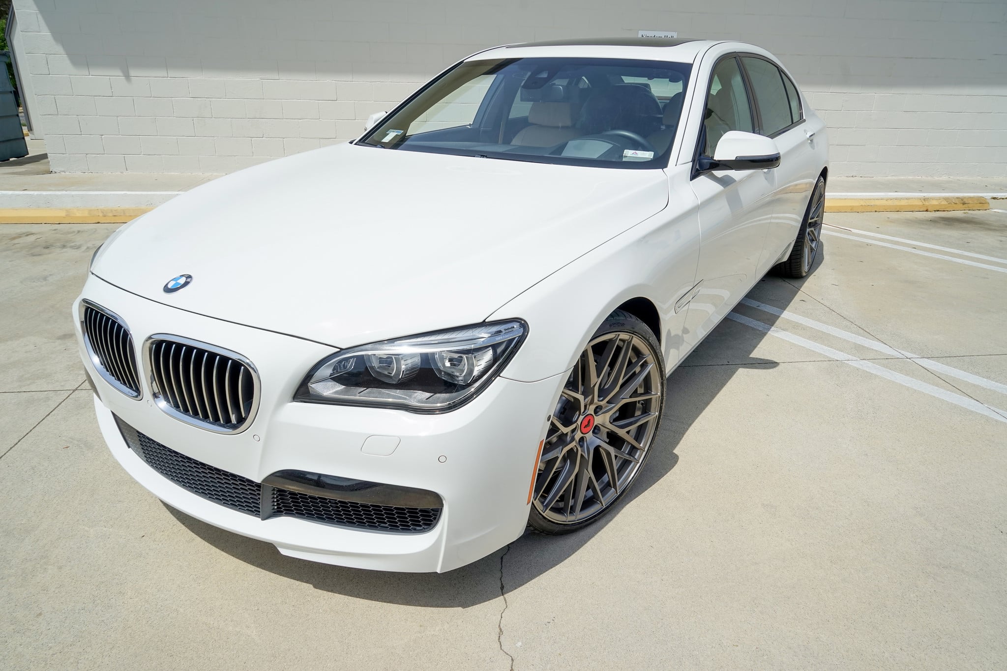 Aftermarket Front Bumper on White BMW 7-Series - Photo by Vorsteiner