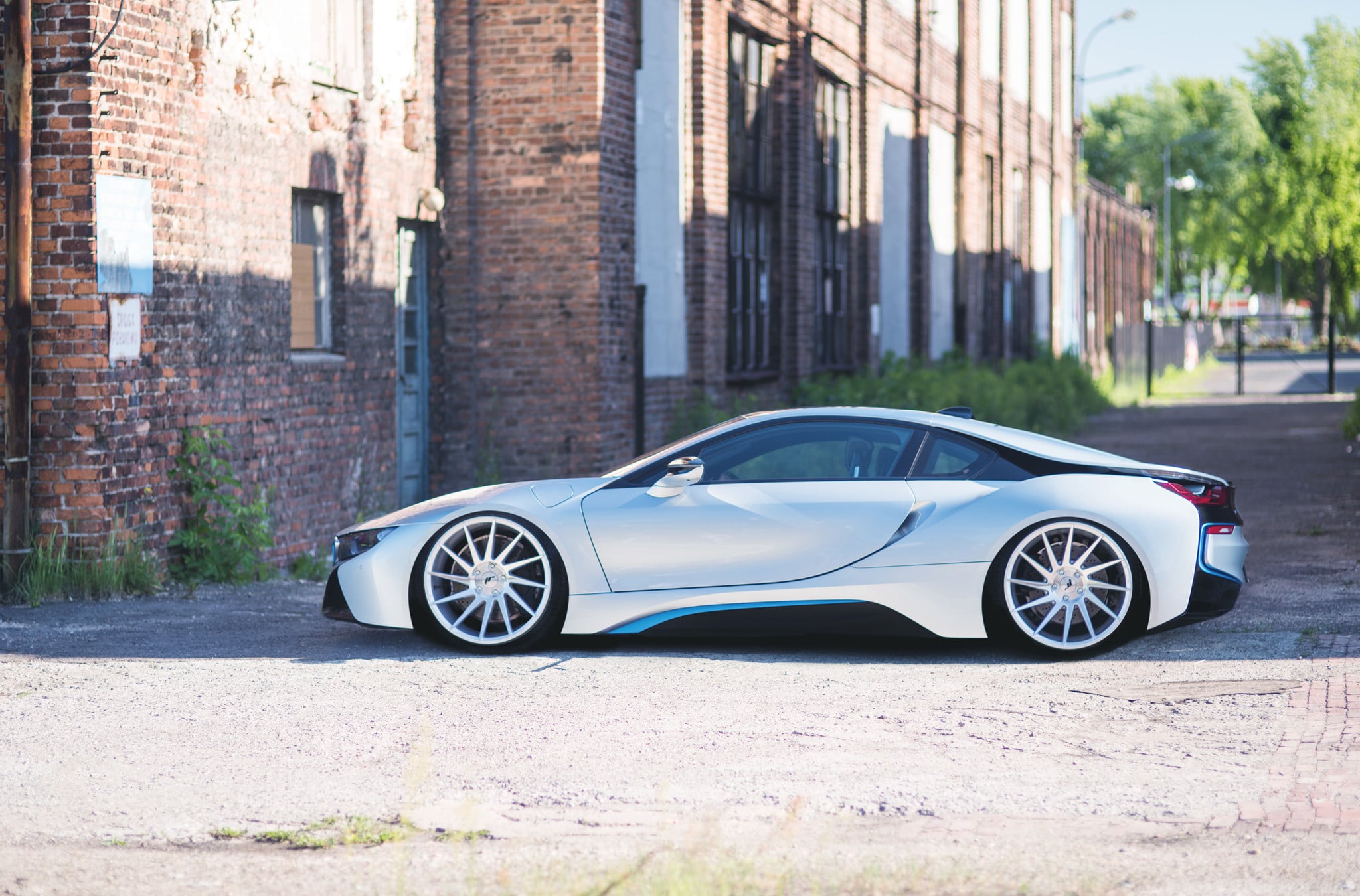 Custom Side Skirts with Blue Accents on White BMW i8 - Photo by JR Wheels