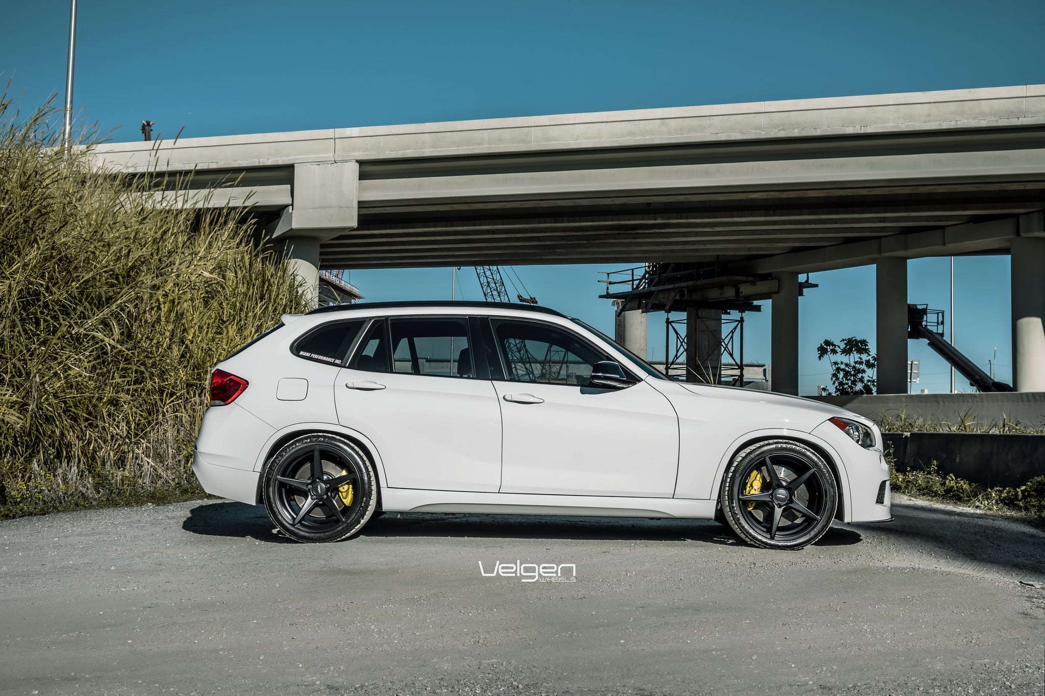 Custom White BMW X1 Side Skirts - Photo by Velgen