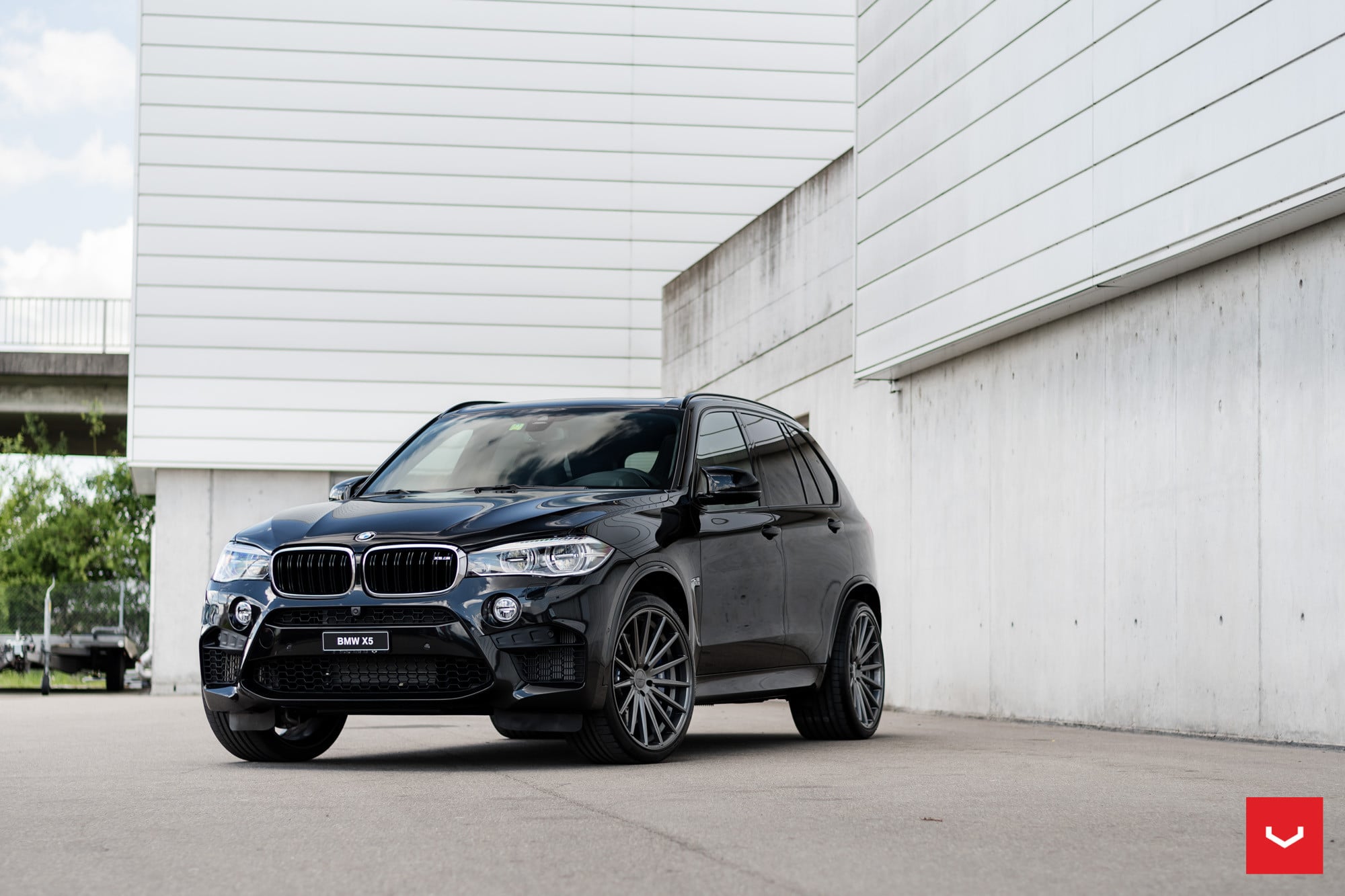 Black BMW X5 with Blacked Out Custom Front Bumper - Photo by Vossen