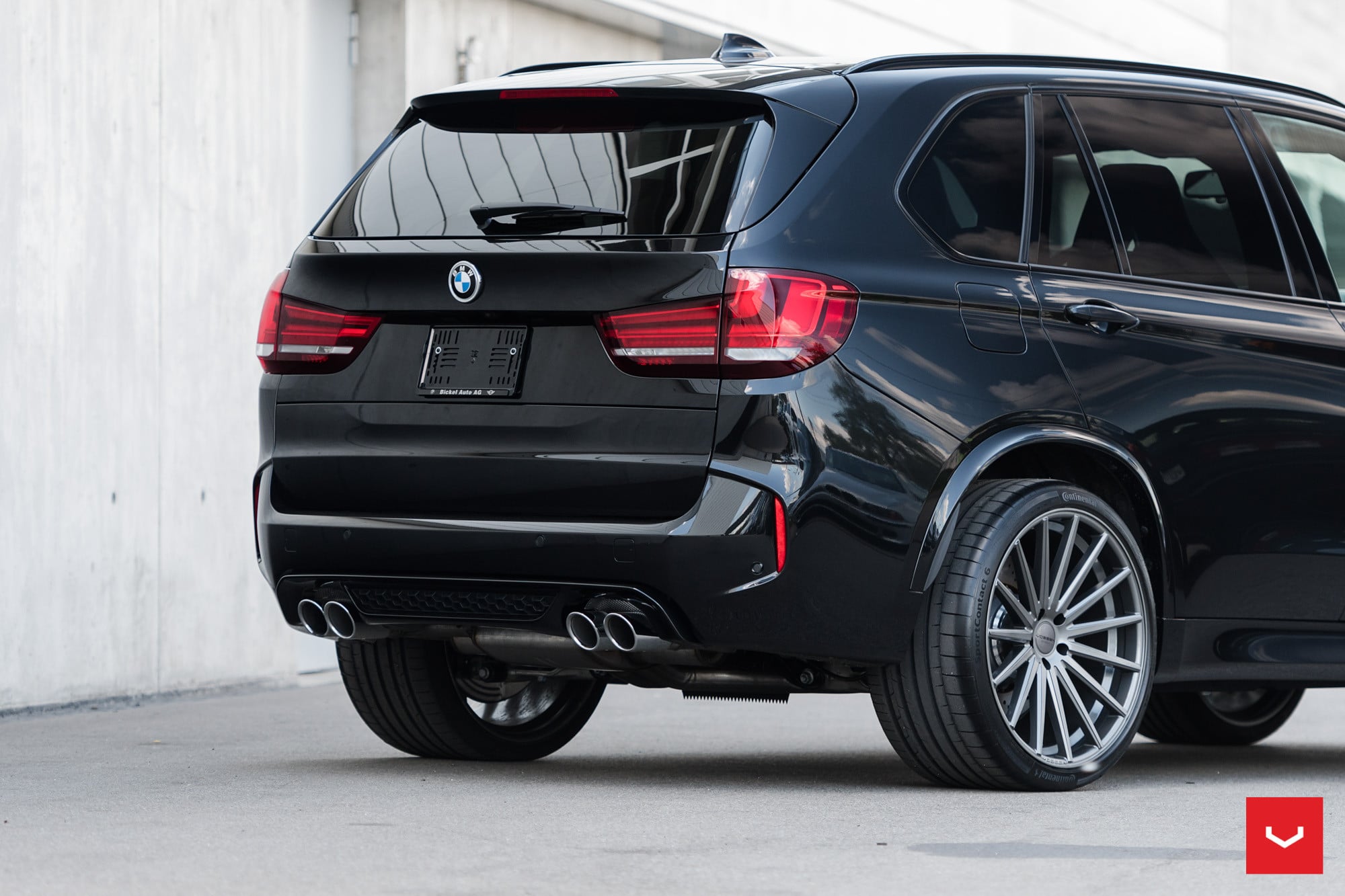 Aftermarket Rear Diffuser with Dual Exhaust Tips on Black BMW X5 - Photo by Vossen