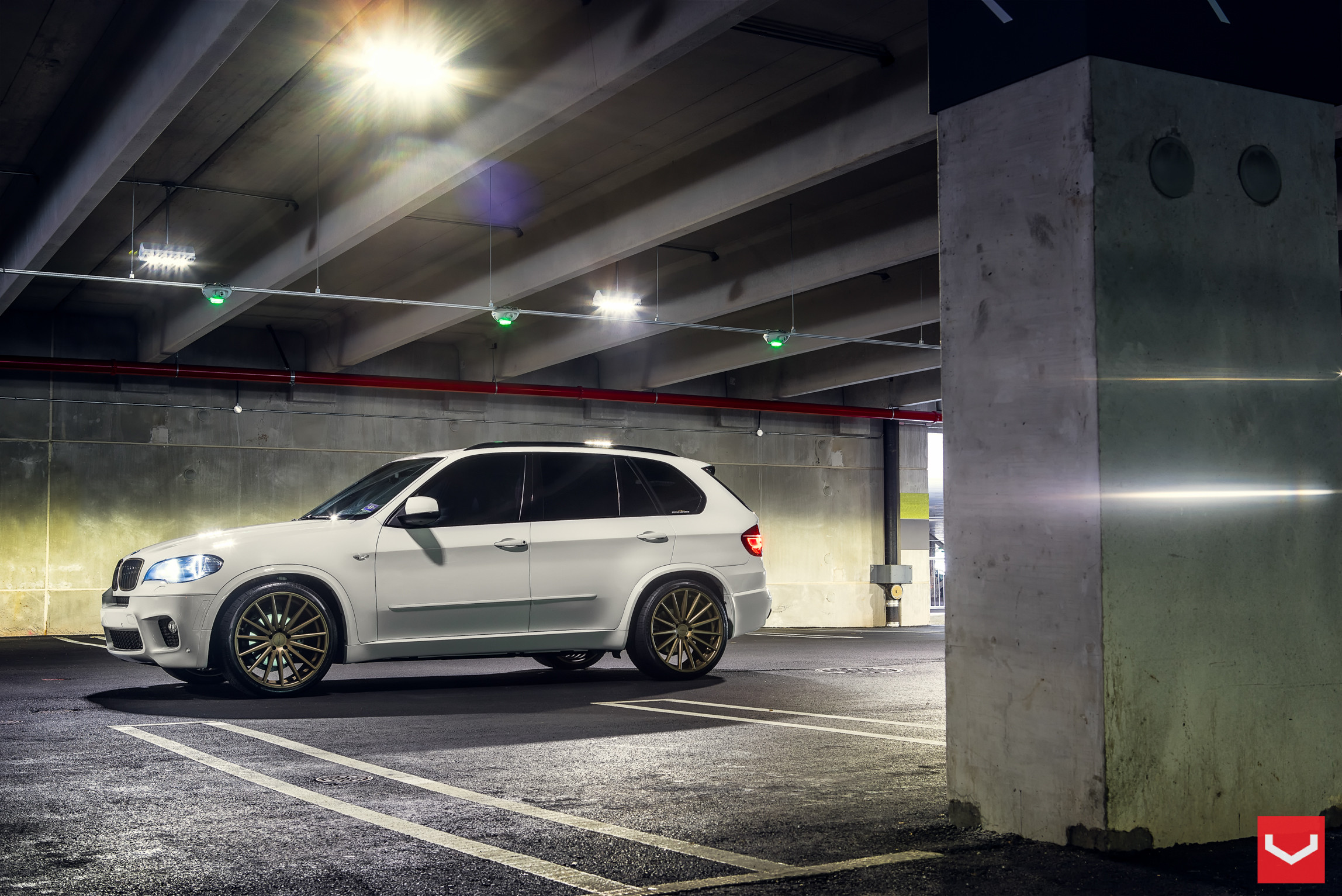White BMW X5 with Aftermarket Bodyside Moldings - Photo by Vossen