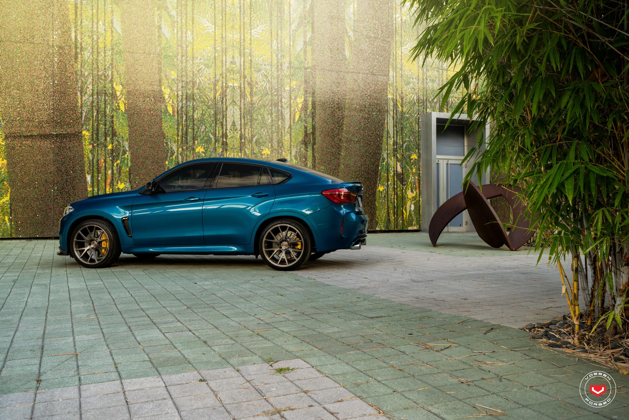 Blue BMW X6 with Aftermarket Side Skirts - Photo by Vossen