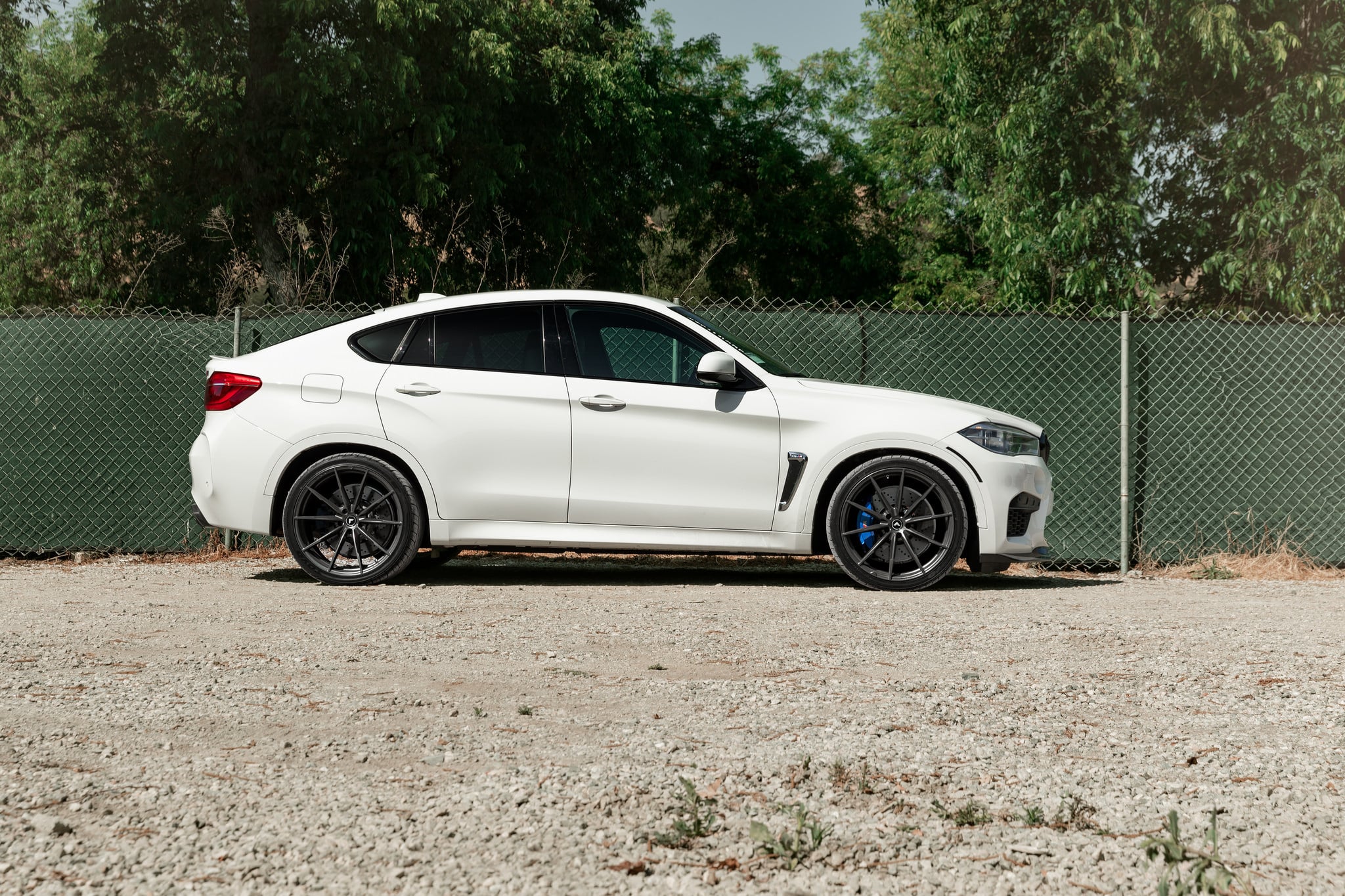 Custom White BMW X6 Side Skirts - Photo by Vorsteiner