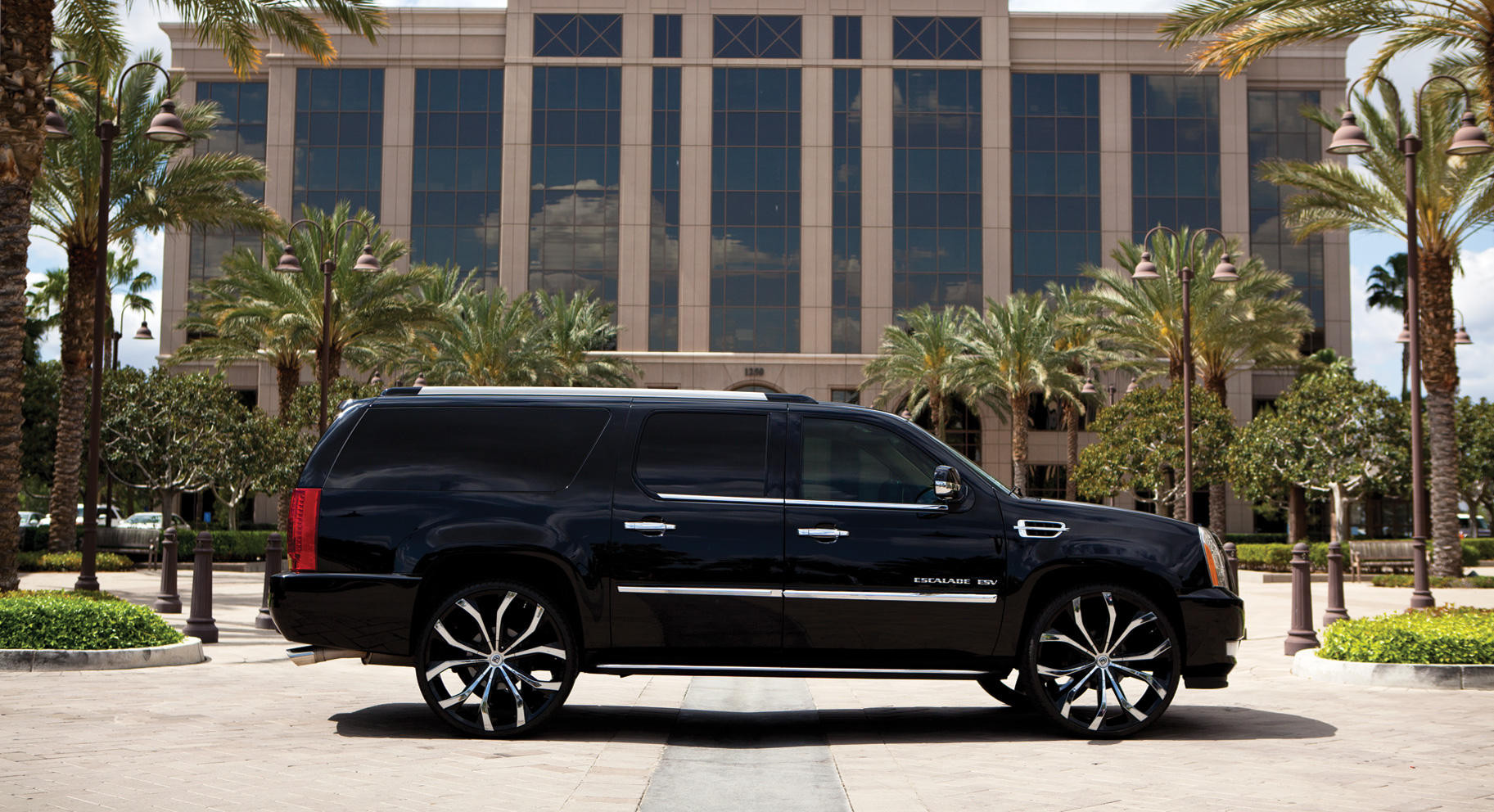 Black and Chrome Lexani Rims on Custom Cadillac Escalade - Photo by Lexani
