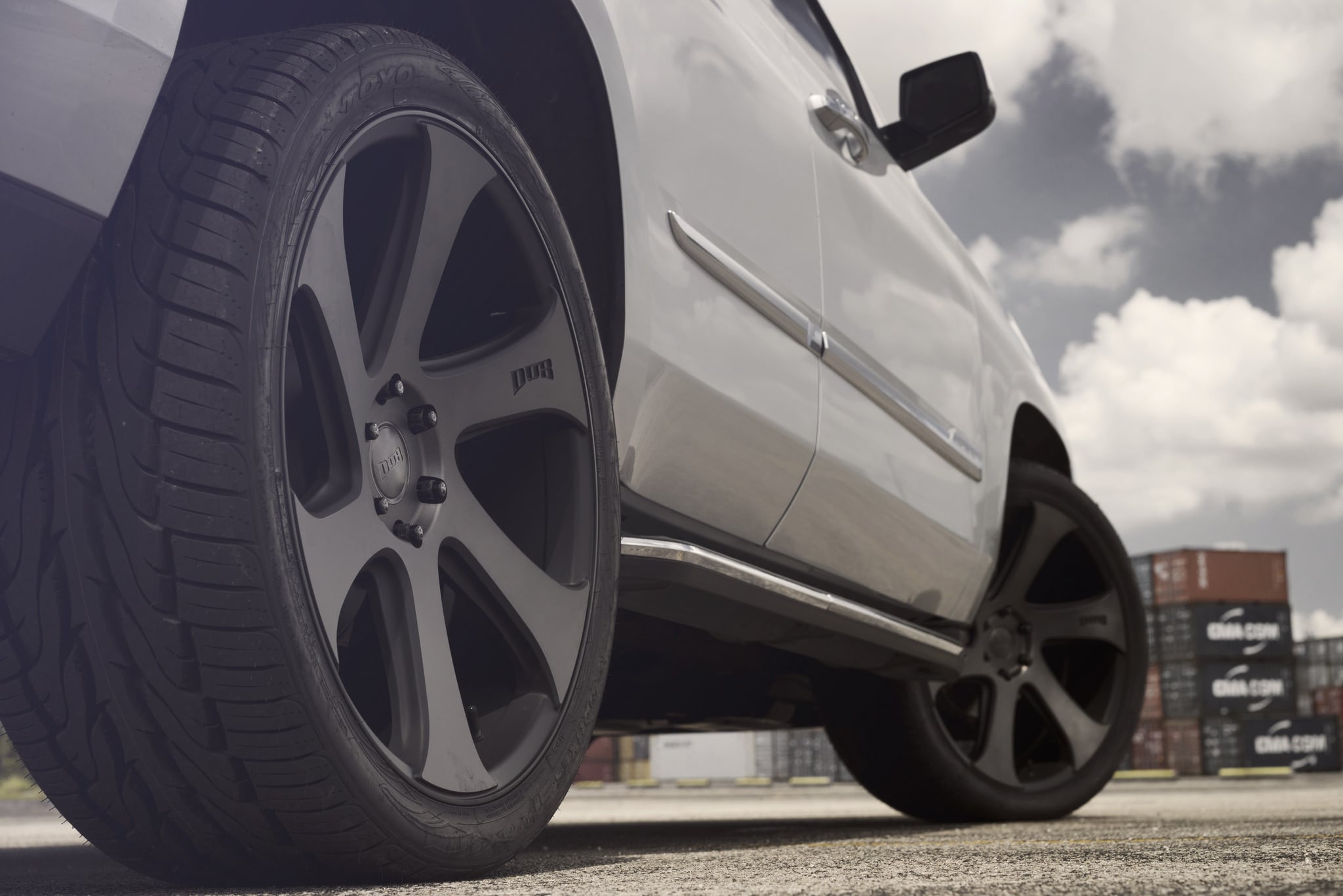 Custom DUB Wheels with Dark Tint on Cadillac Escalade  - Photo by DUB