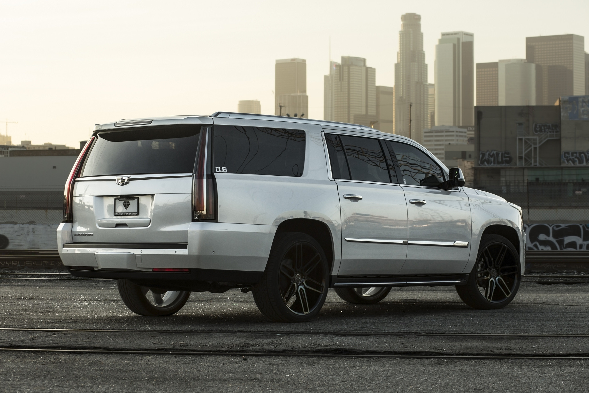 Gray Cadillac Escalade with Roofline Spoiler - Photo by Blaque Diamond Wheels