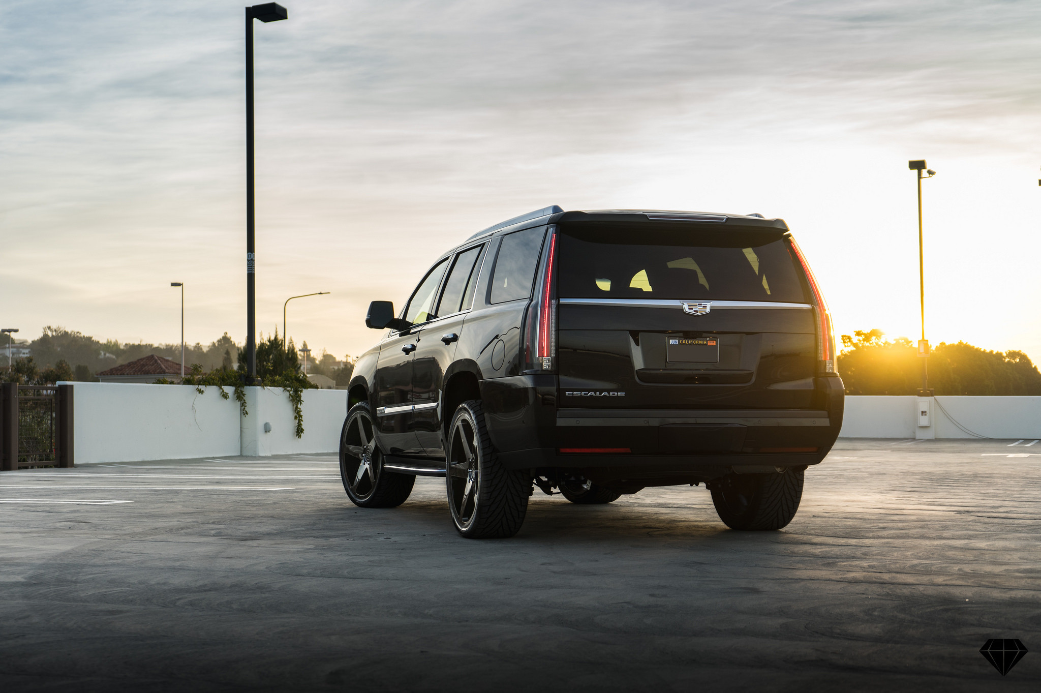 Black Cadillac Escalade with Custom Roofline Spoiler - Photo by Blaque Diamond Wheels