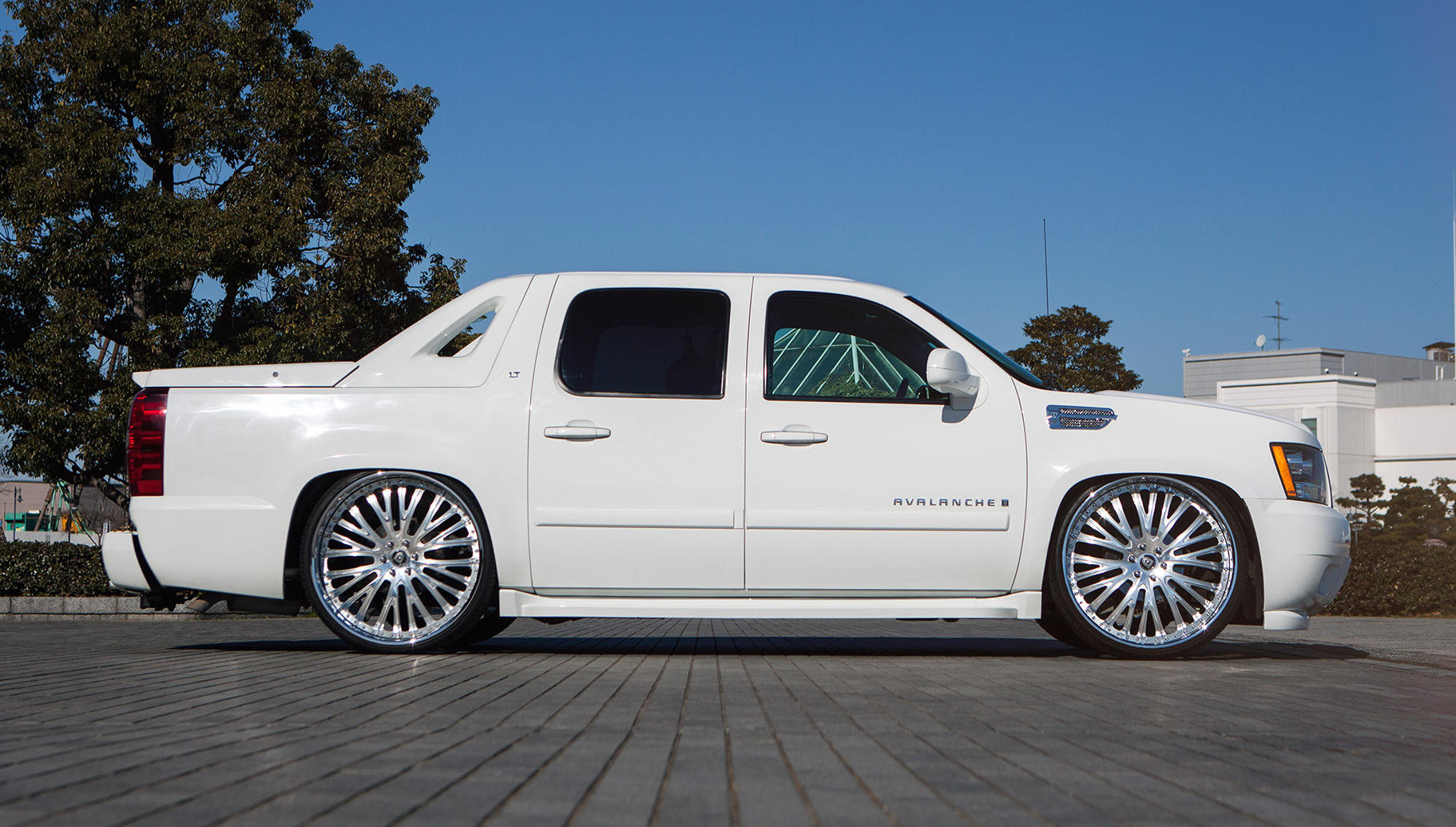 White Chevy Avalanche with Custom Side Skirts - Photo by Lexani