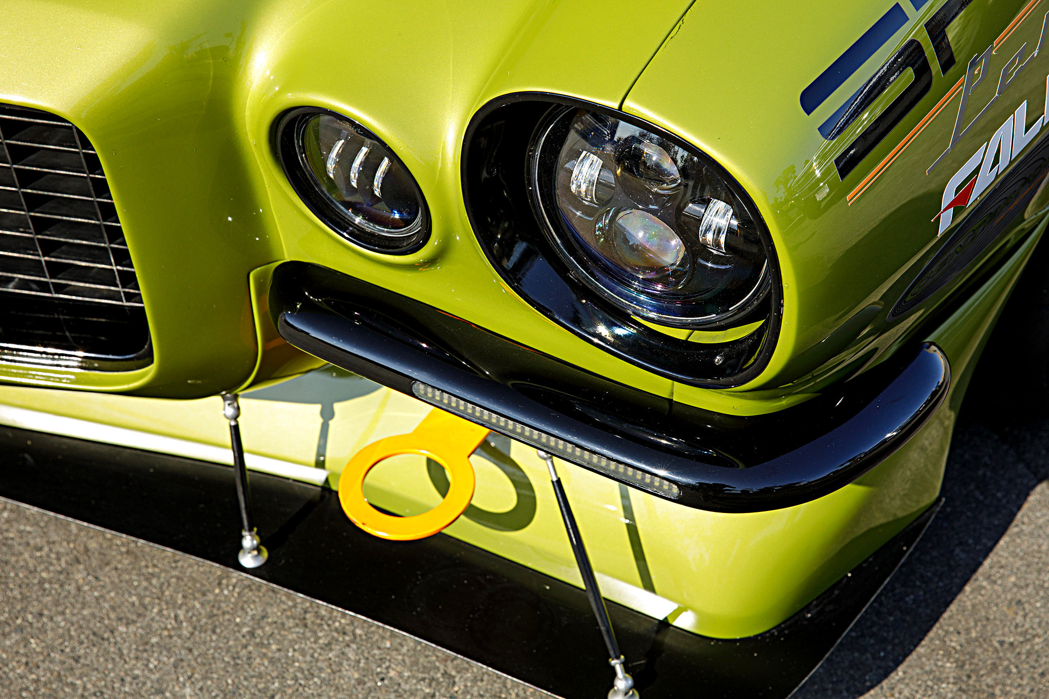 Dark Smoke Headlights on Green Debadged Chevy Camaro - Photo by Robert McGaffin and Super Chevy Staff