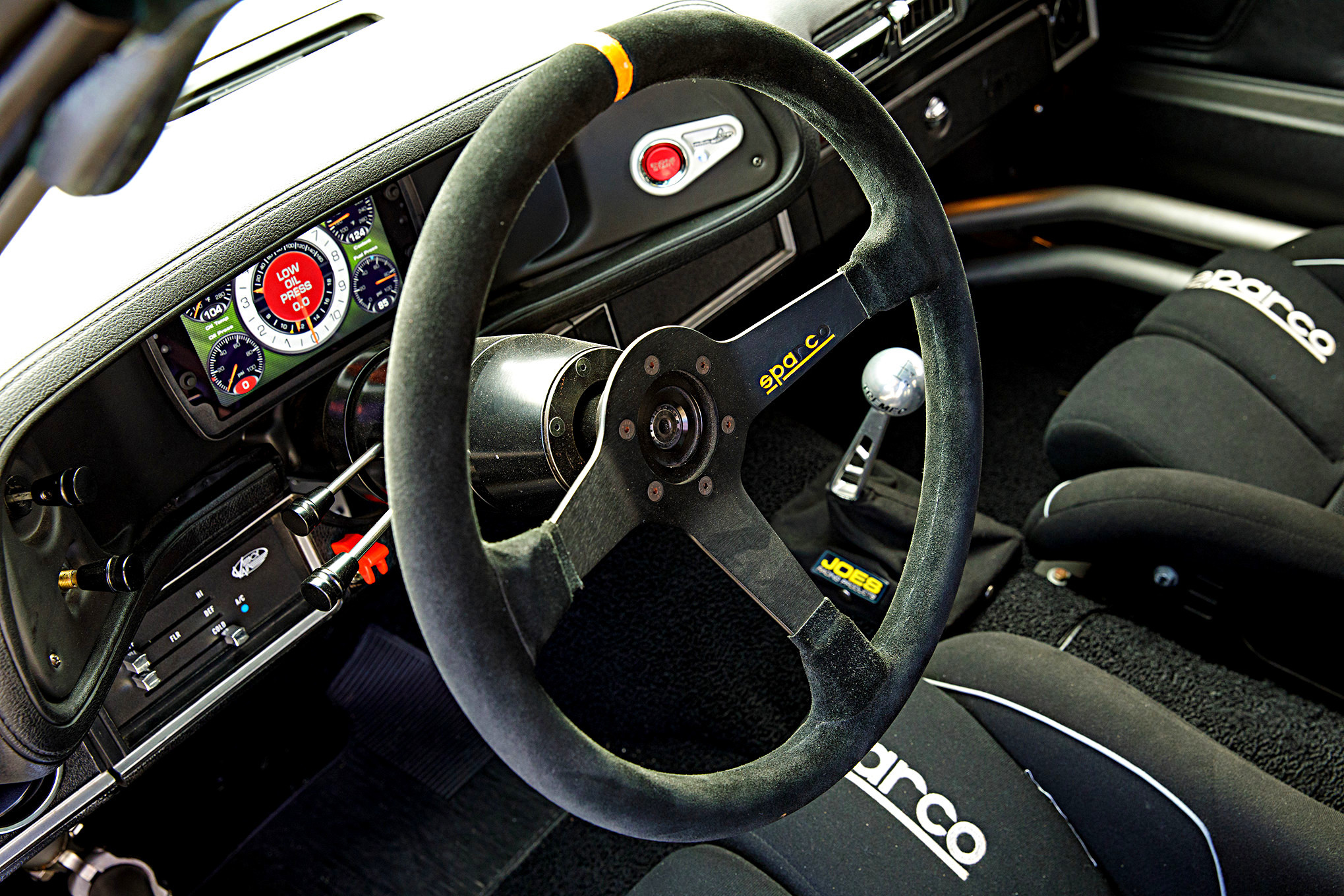 Sparco Steering Wheel in Green Debadged Chevy Camaro - Photo by Robert McGaffin and Super Chevy Staff
