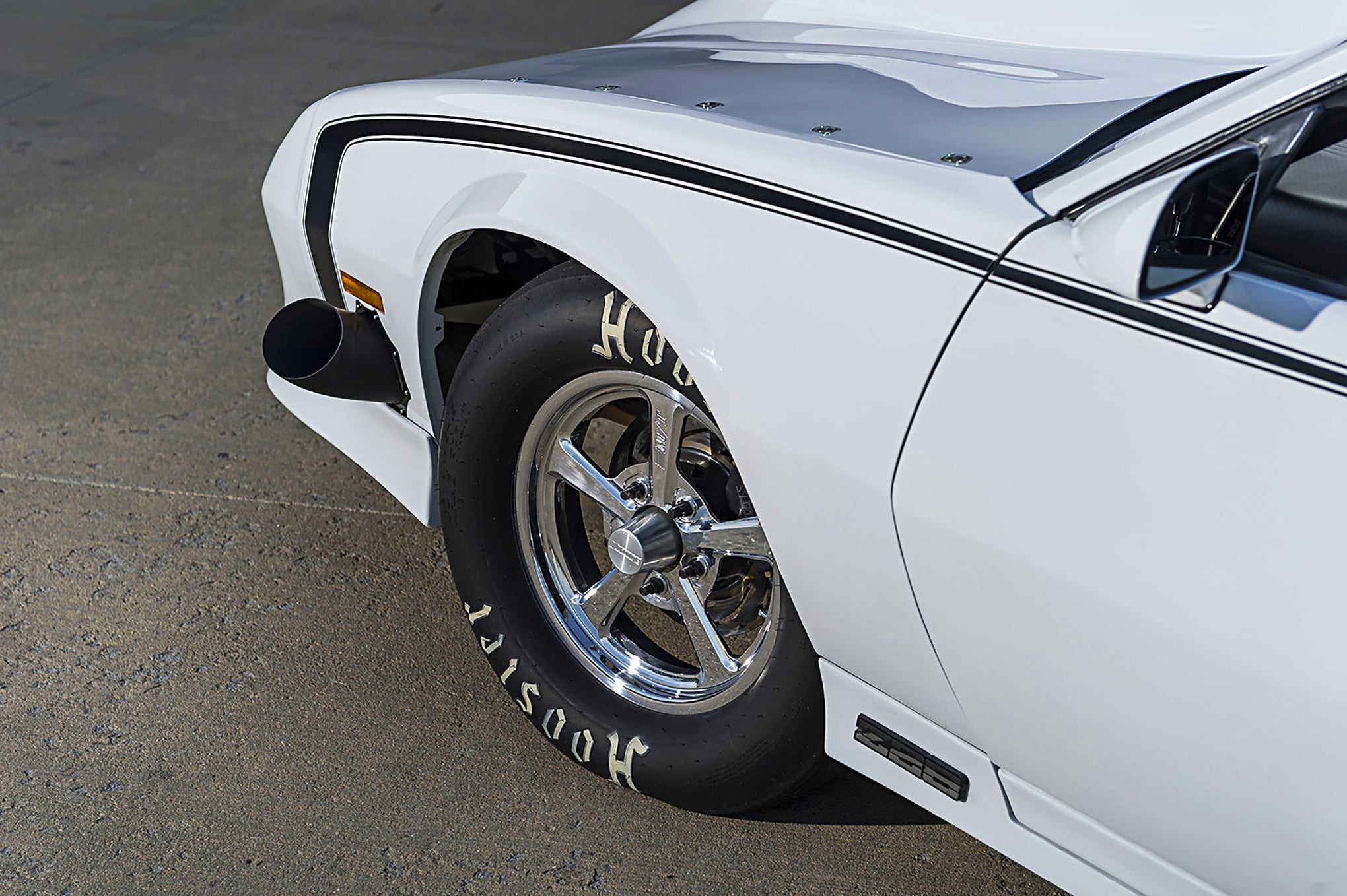 White Chevy Camaro with Custom Chrome Wheels - Photo by Grant Cox