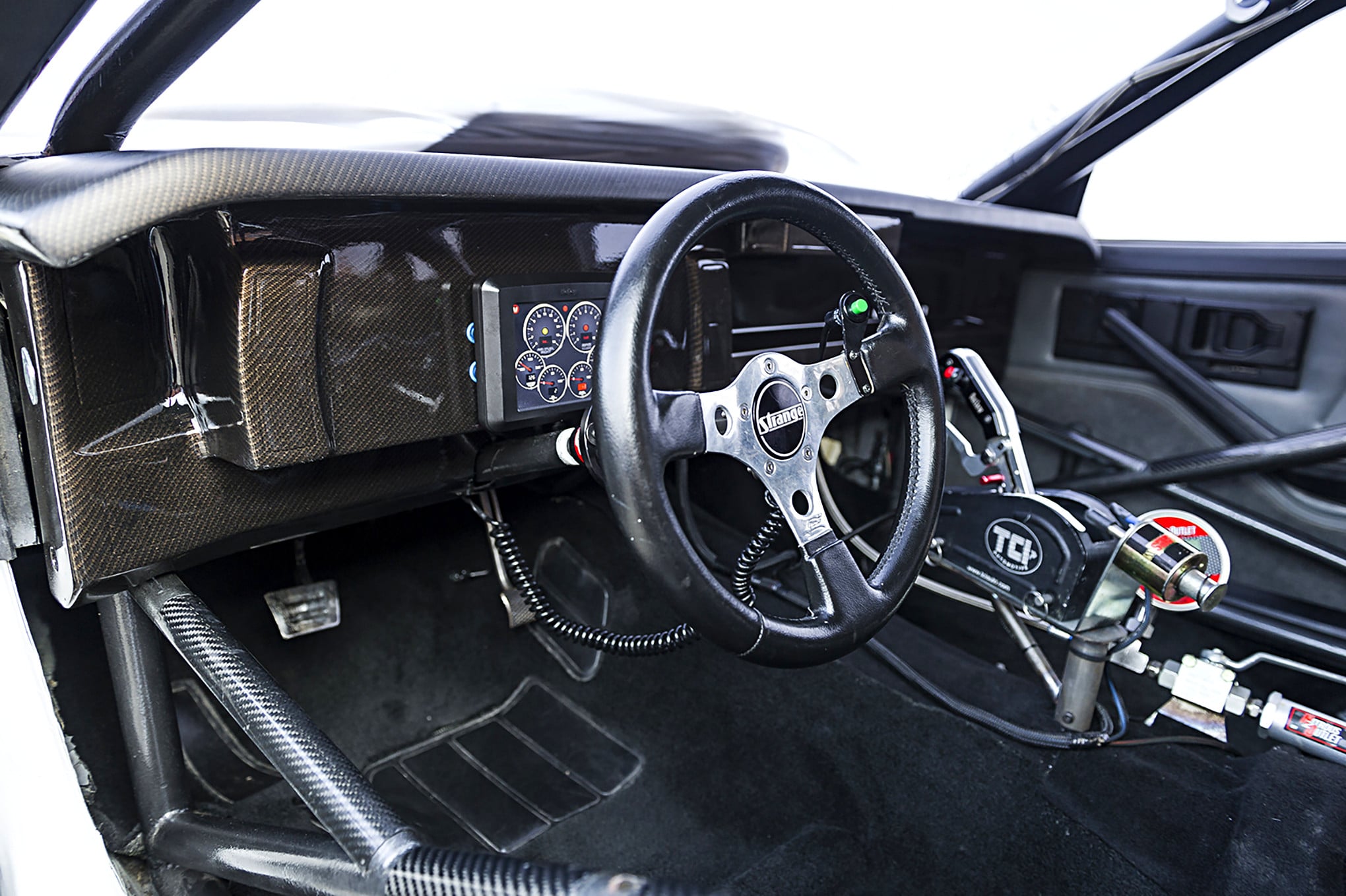 White Chevy Camaro with Strange Steering Wheel - Photo by Grant Cox