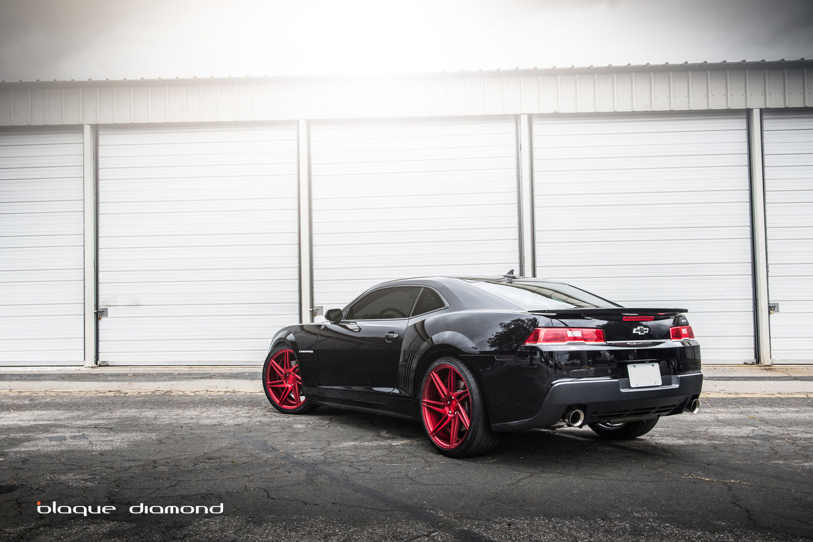 Black Chevy Camaro With Red Custom Wheels - Photo by Blaque Diamond