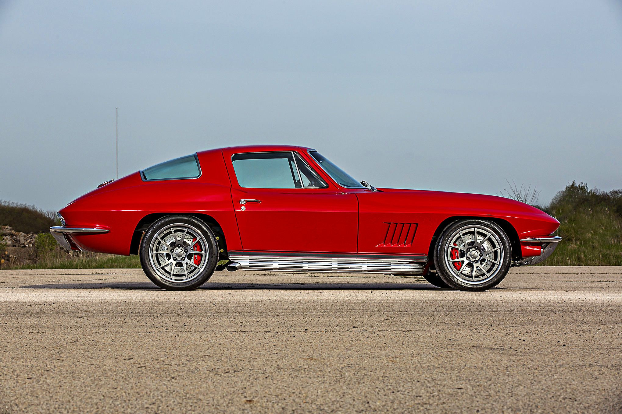 Red Chevy Corvette with Chrome Side Skirts - Photo by Forgeline Motorsports