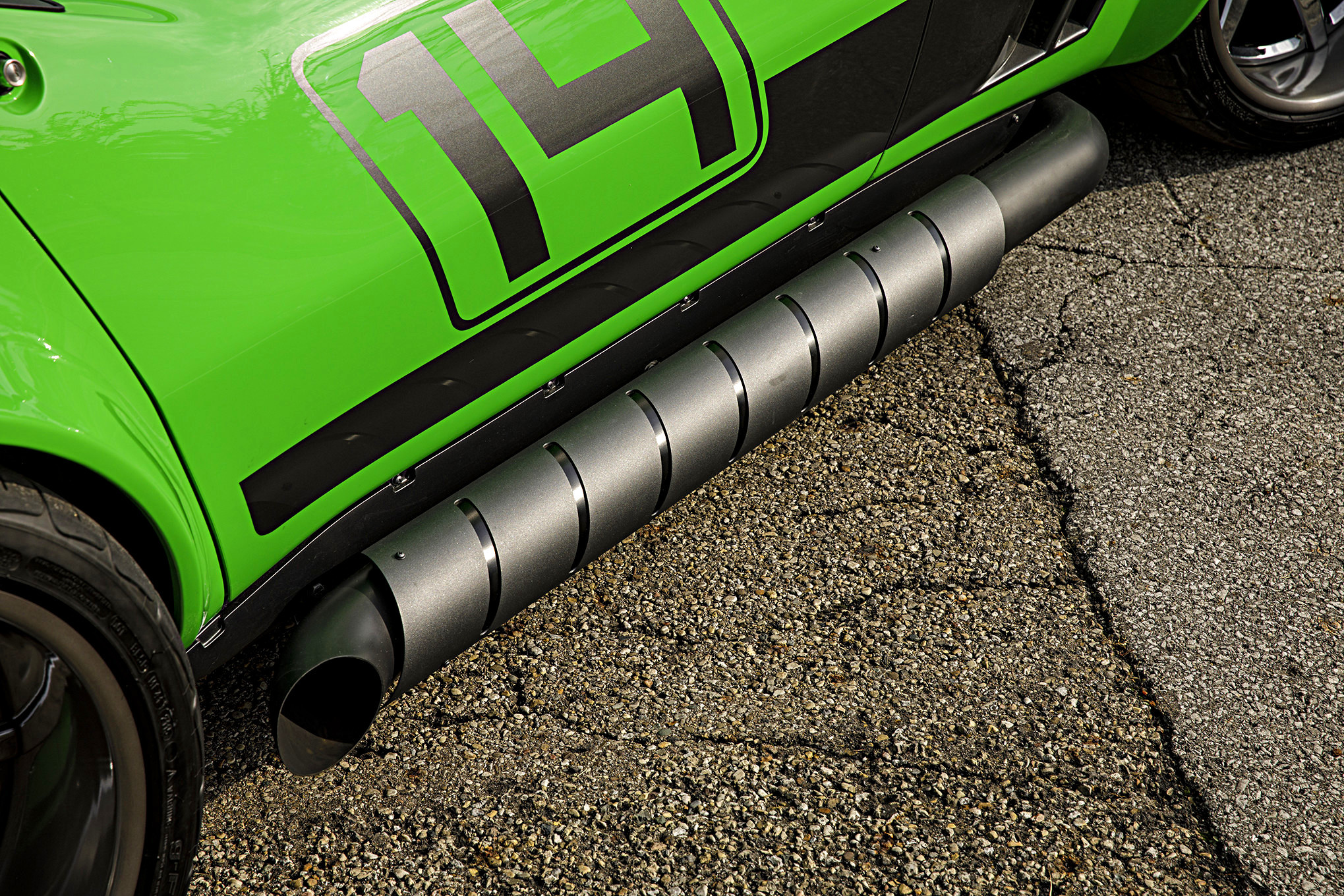 Custom Exhaust System on Green Debadged Chevy Corvette - Photo by Robert McGaffin