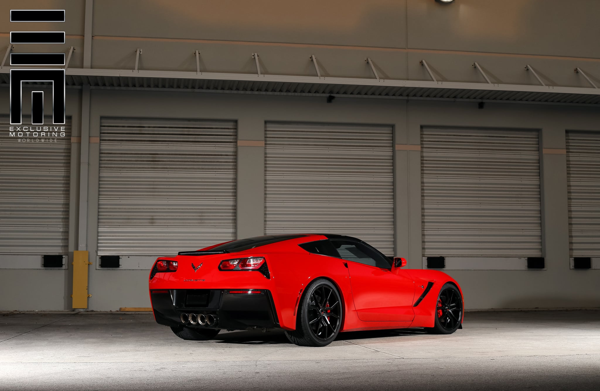 Candy Red Vette C7 on black wheels rear view - Photo by Exclusive Motoring
