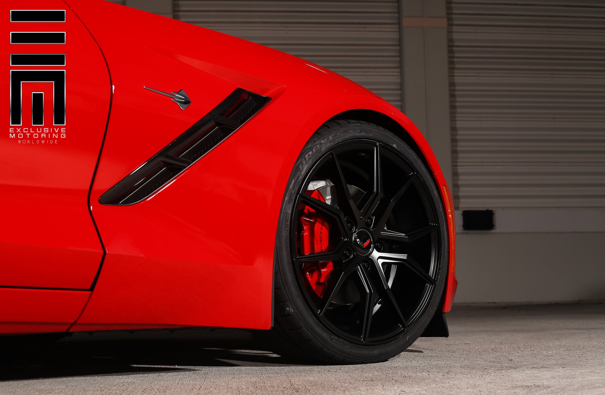 Black multispoke rim with red caliper cover on Corvette C7 - Photo by Exclusive Motoring
