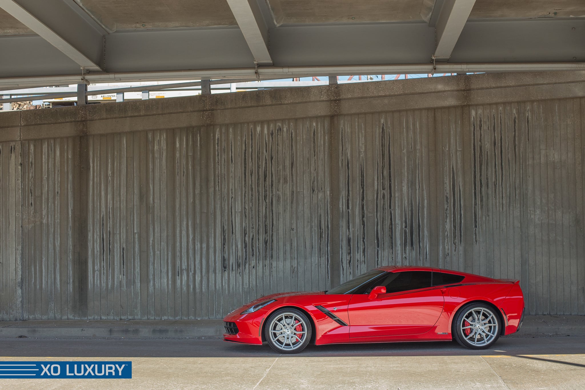 Red Chevy Corvette With Aftermarket Rims - Photo by XO Luxury