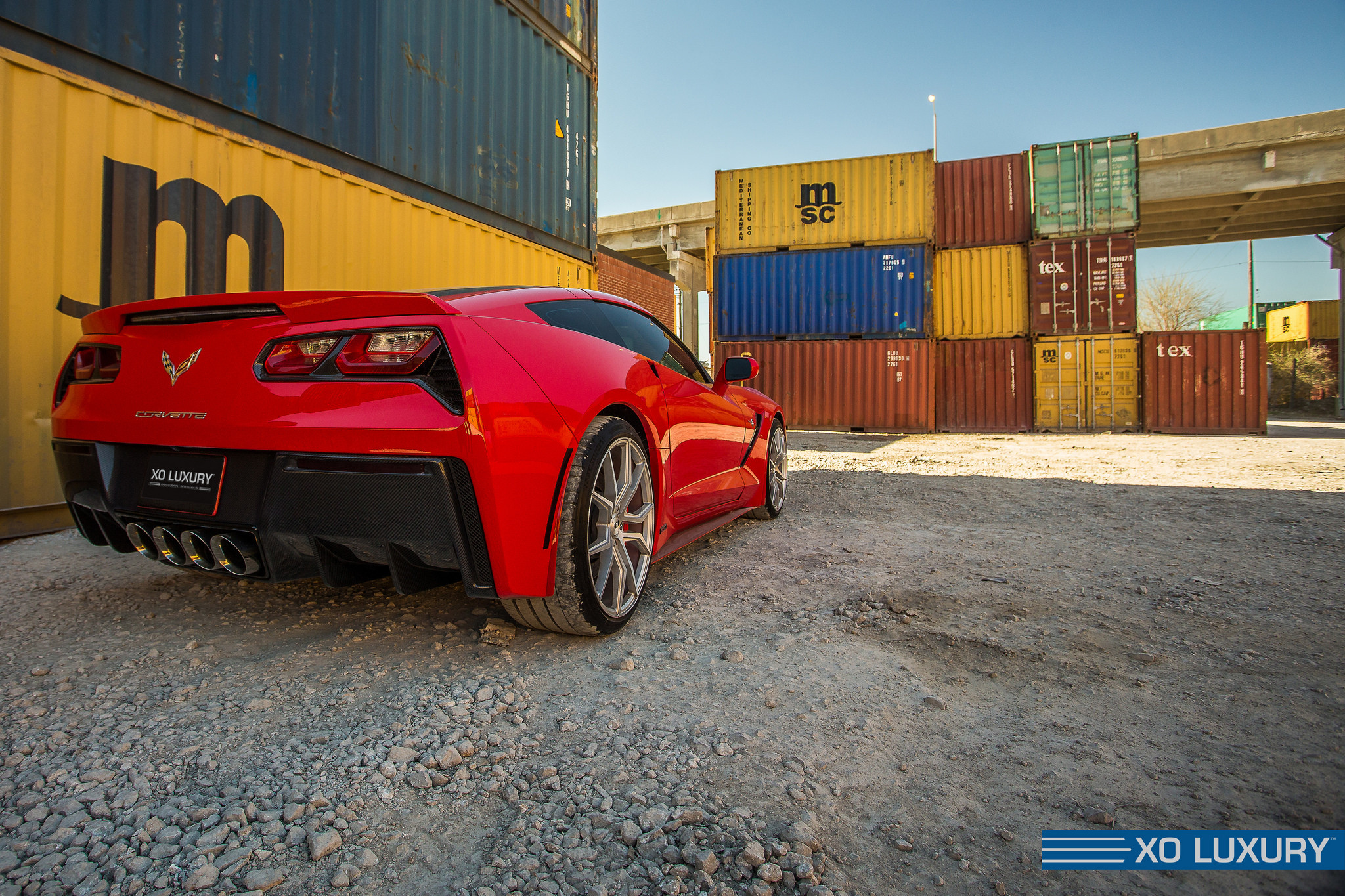Red Chevy Corvette in the Docks - Photo by XO Luxury