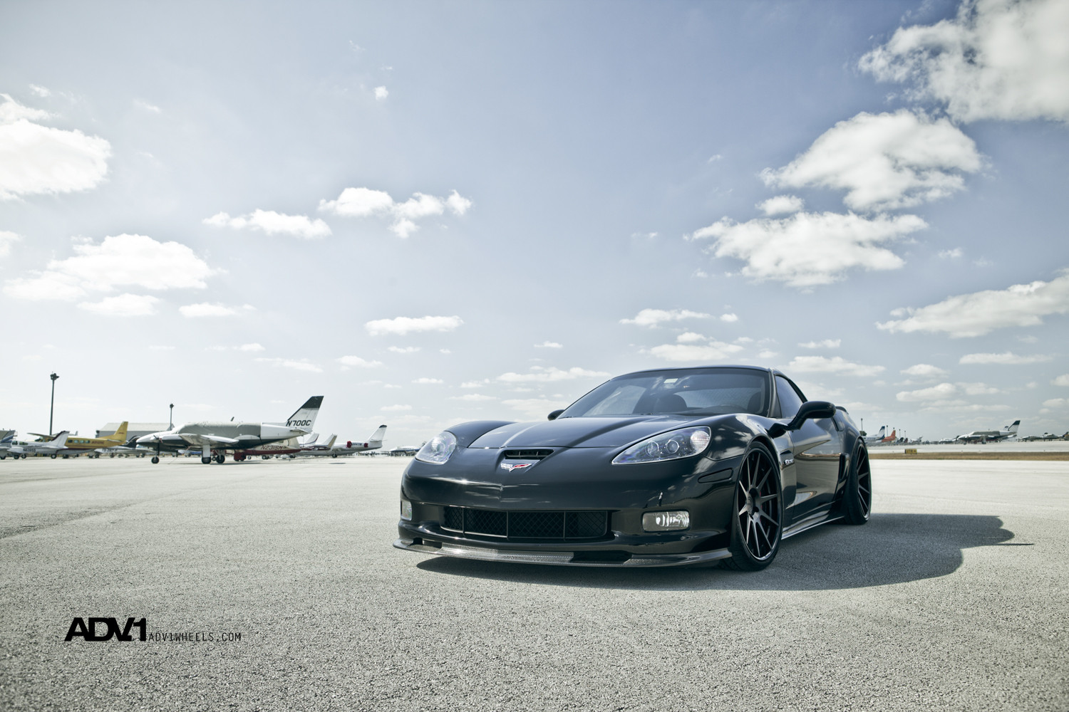 Carbon Fiber Front Lip on Stealth Black Chevy Corvette - Photo by ADV.1