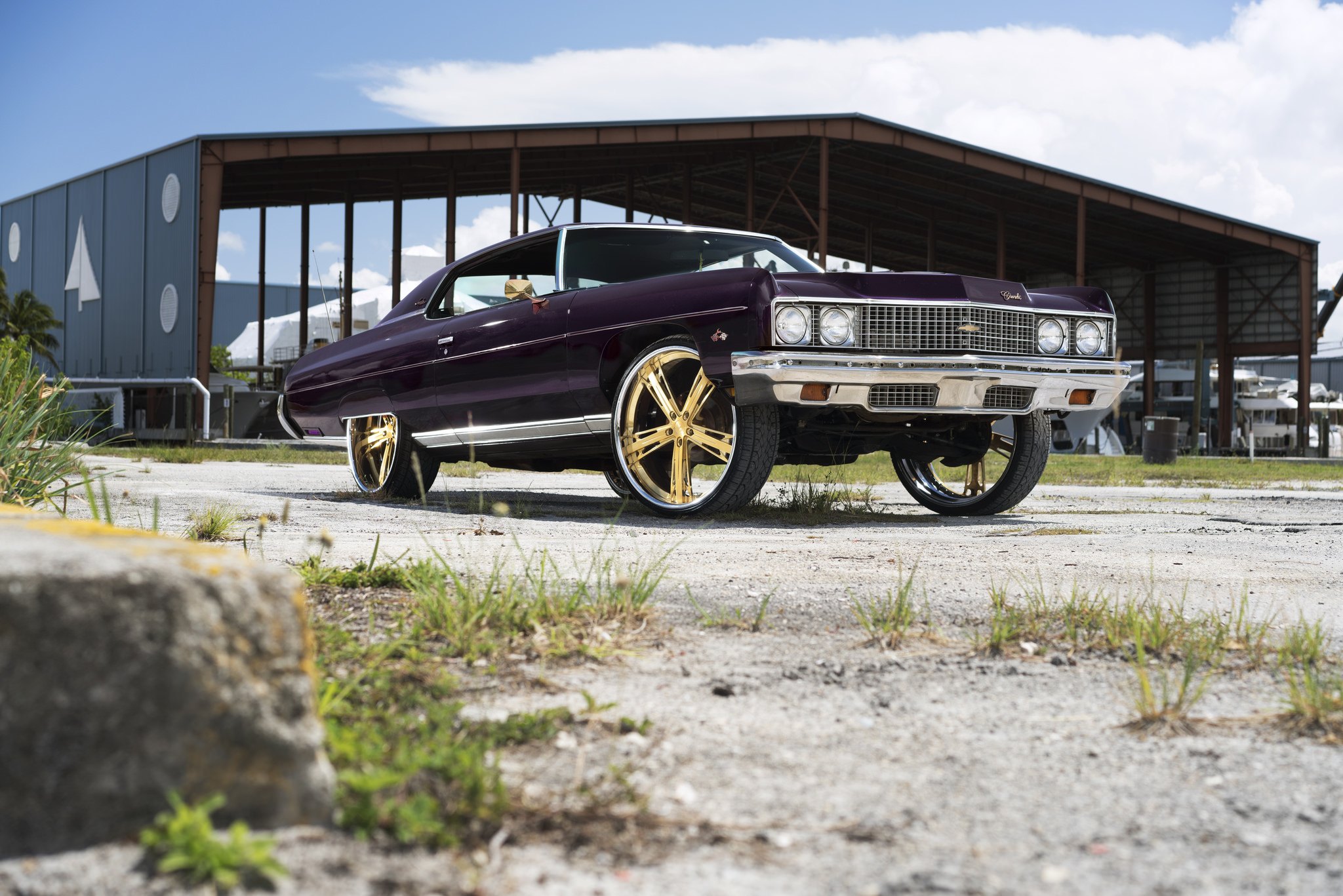 Lifted Purple Chevy Impala on Gold Wheels - Photo by DUB.