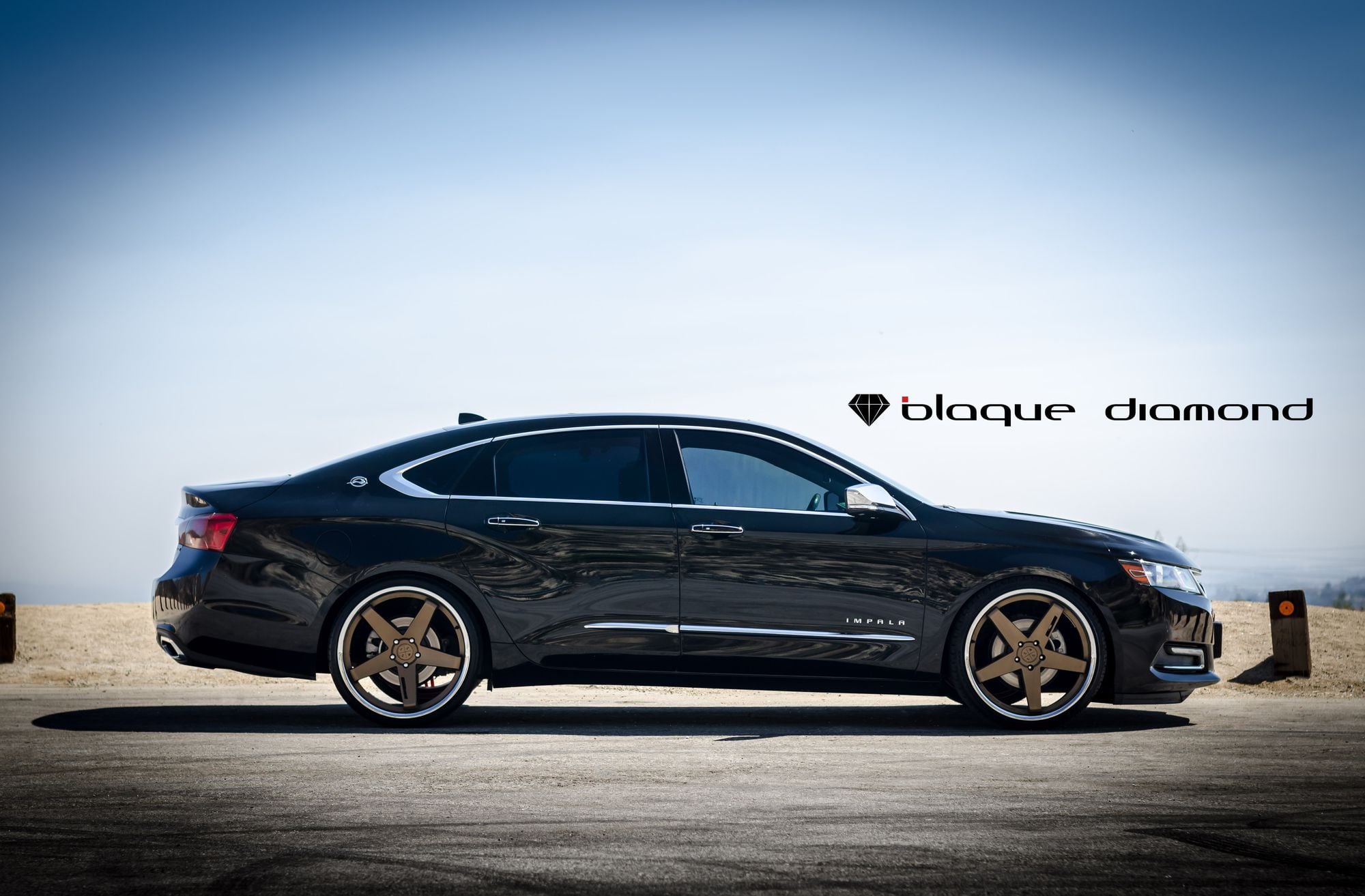 Custom Black Chevy Impala Side Skirts - Photo by Blaque Diamond
