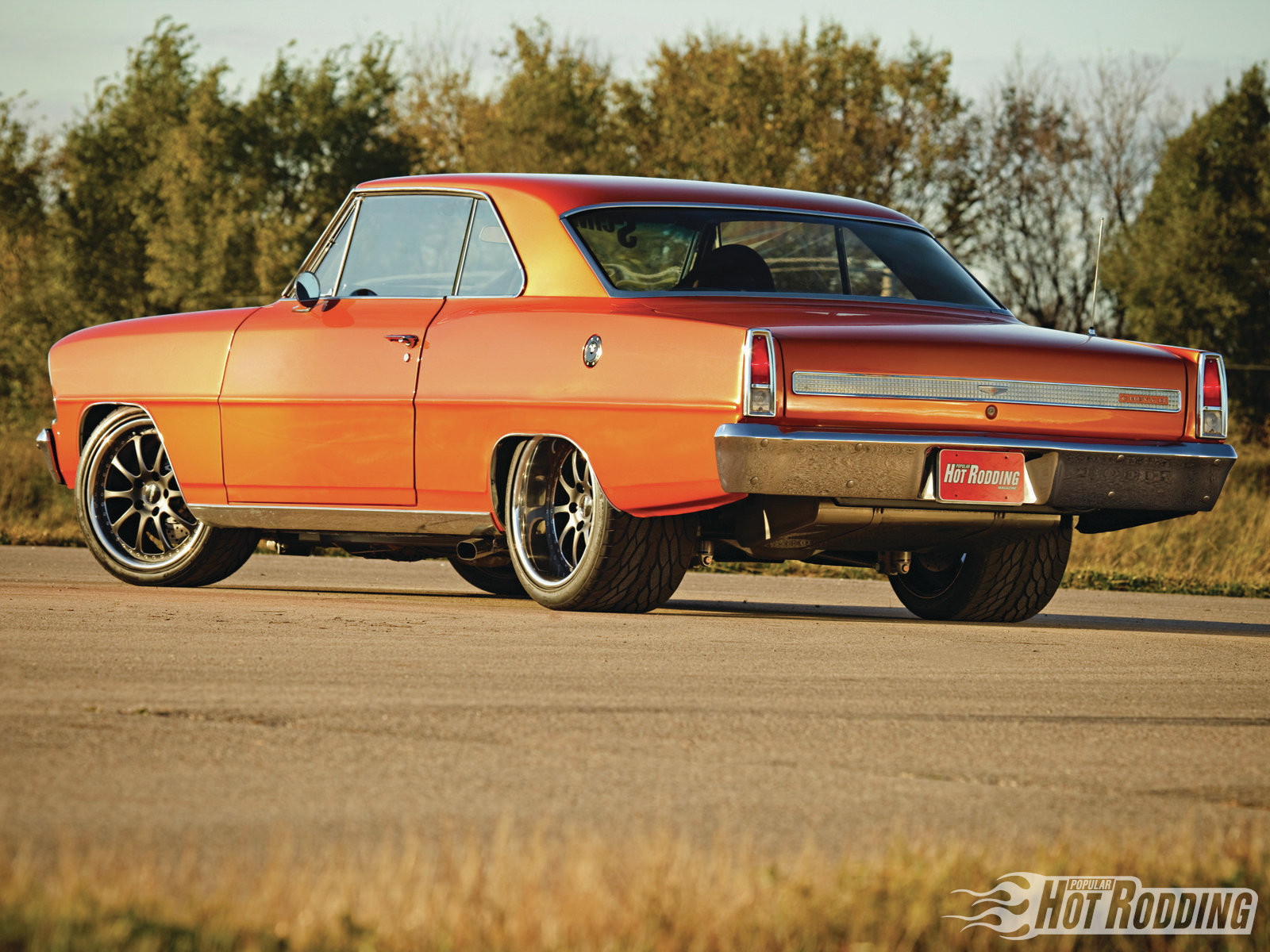 Chrome Rear Bumper Cover on Orange Chevy Chevy II - Photo by Forgeline Motorsports