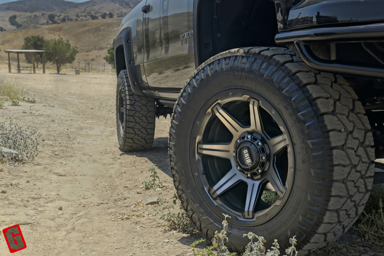 Custom Grid Wheels on Black Lifted Chevy Silverado - Photo by Grid Off-Road