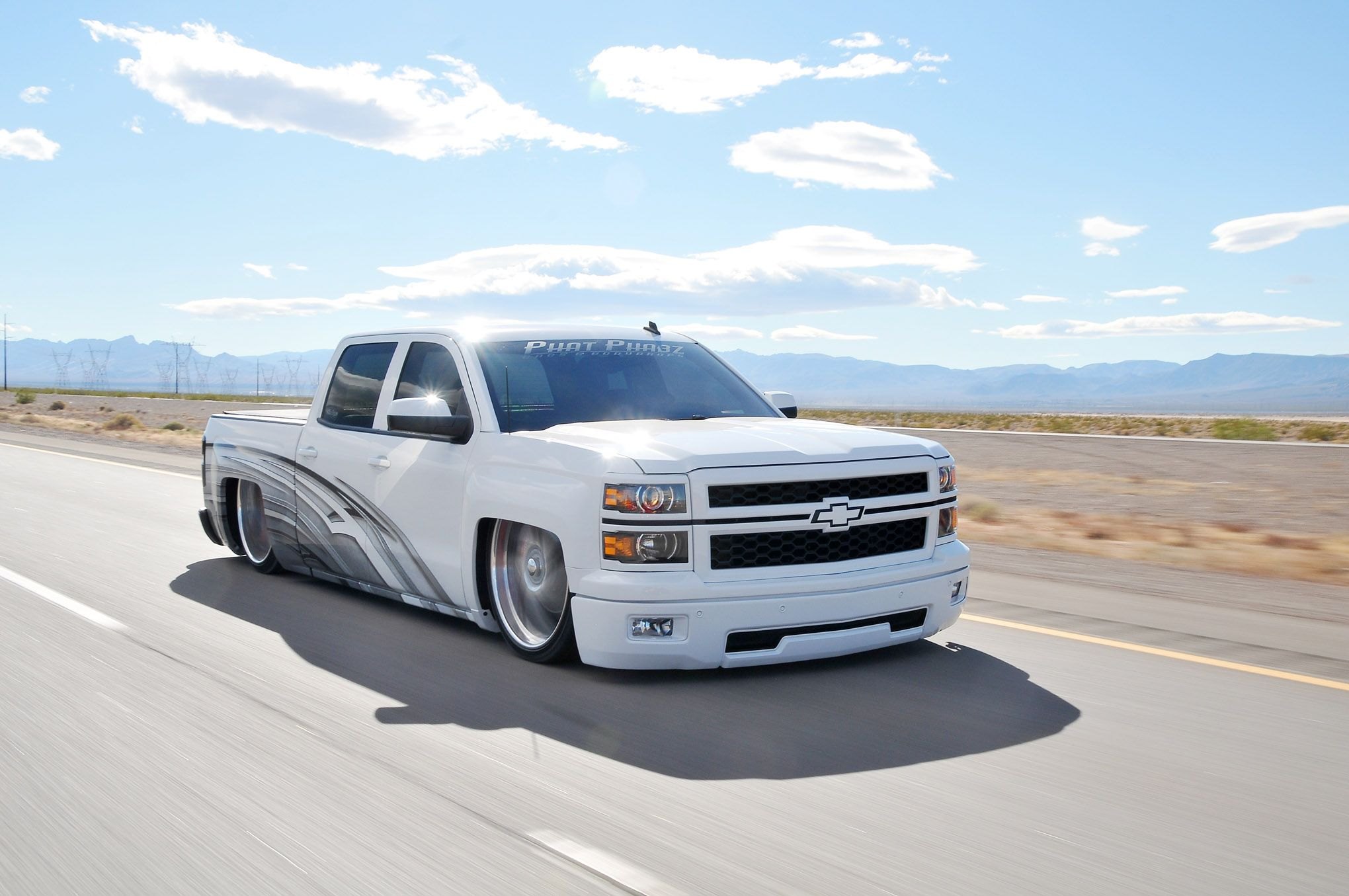White Lowered Chevy Silverado with Custom Mesh Grille - Photo by Phil Gordo...