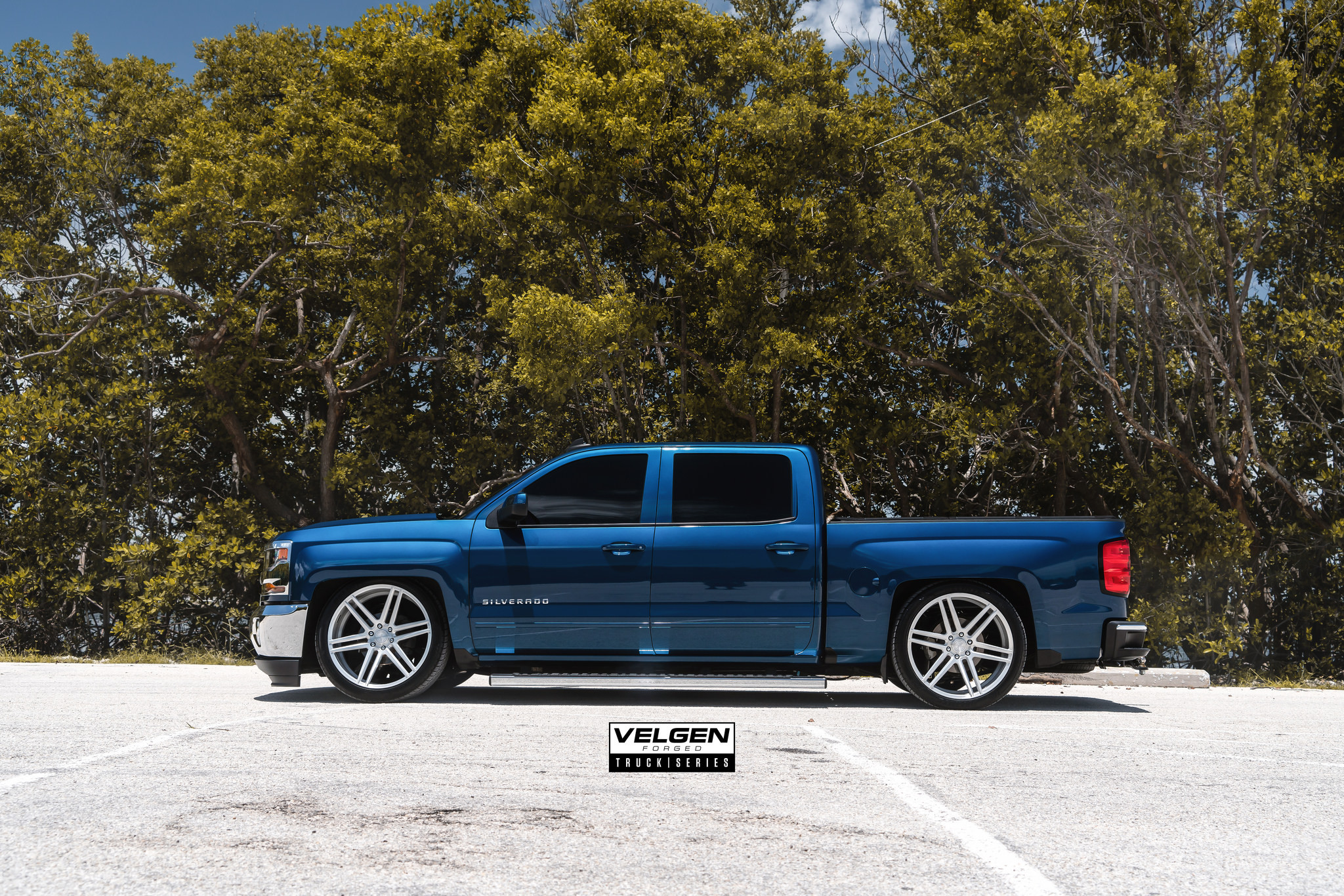 Aftermarket Running Boards on Blue Chevy Silverado - Photo by Velgen
