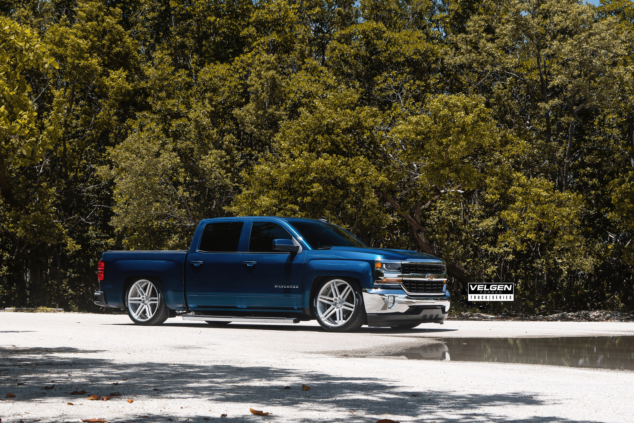 Blue Chevy Silverado with Custom Projector Headlights - Photo by Velgen