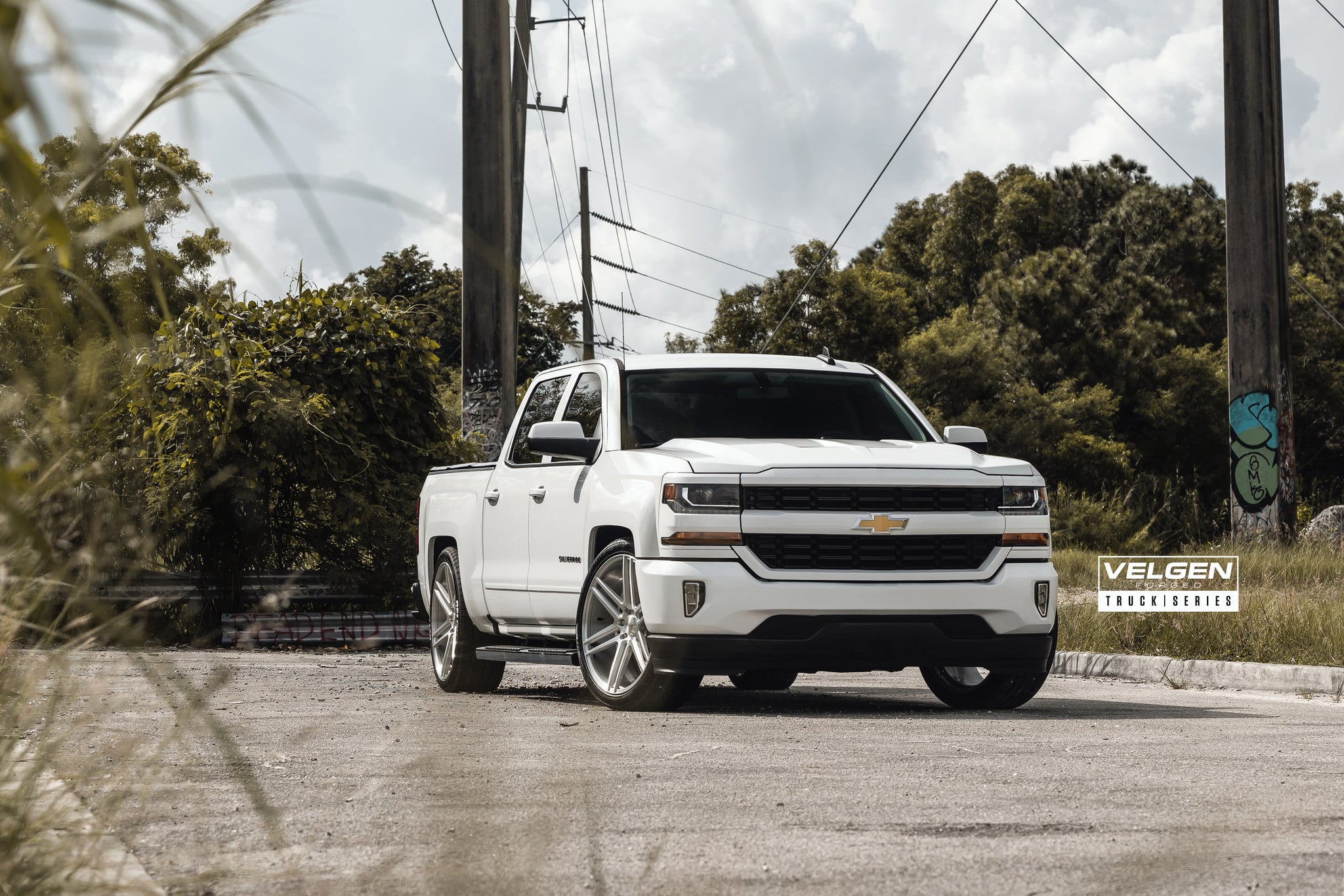 White Chevy Silverado with Aftermarket Projector Headlights - Photo by Velgen Wheels