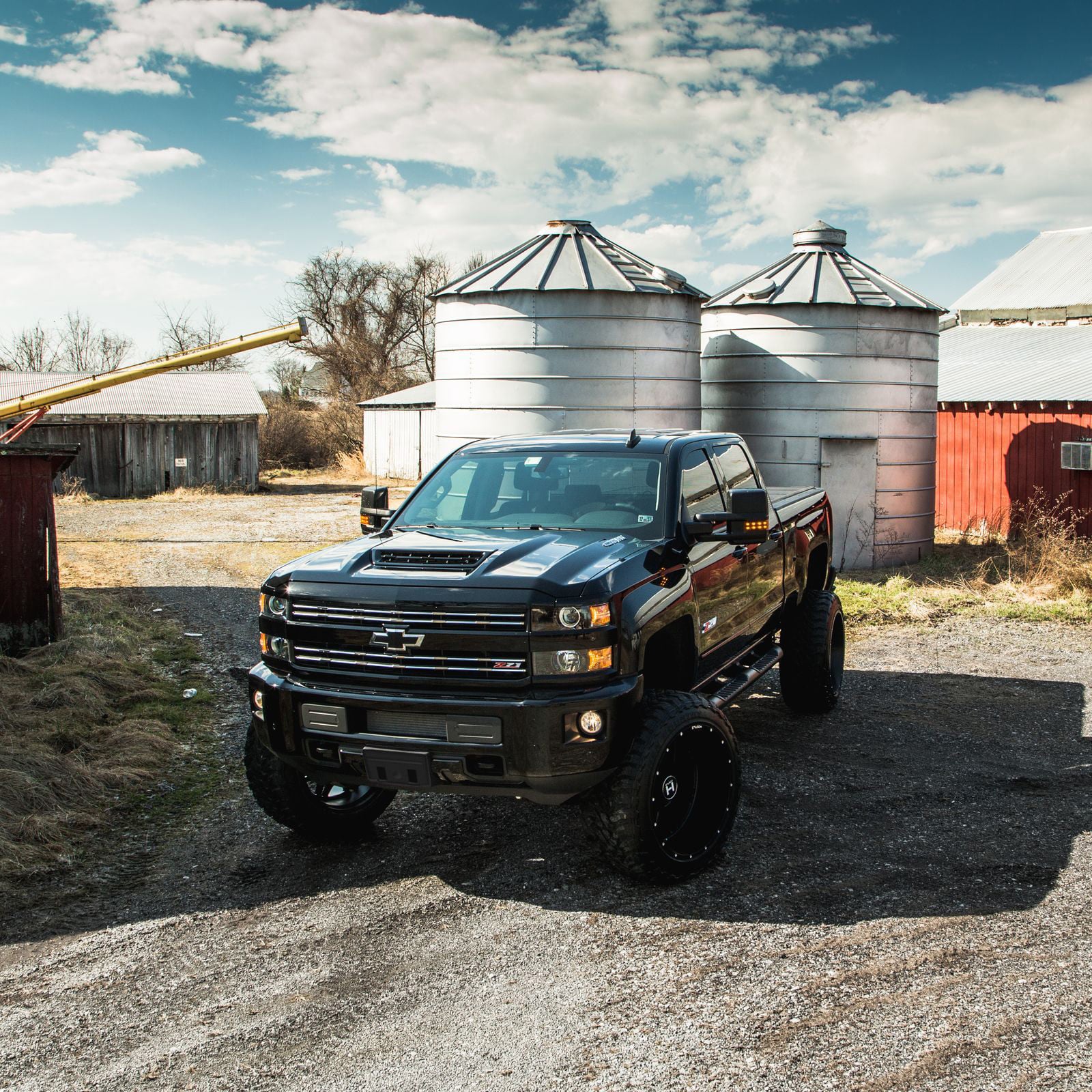 Black Lifted Chevy Silverado with Custom Vented Hood - Photo by CARiD