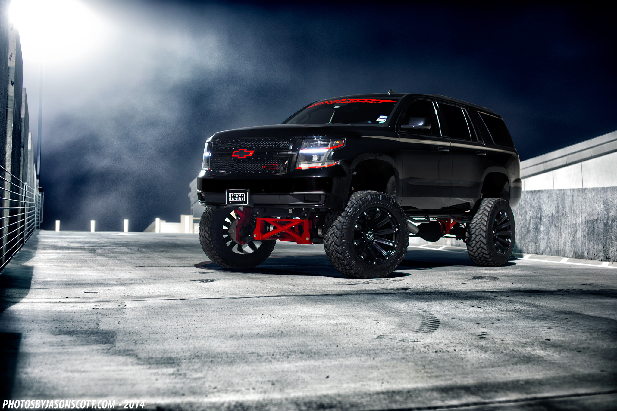 Chevy Tahow with Offroad lift and Mud Tires - Photo by Jason Scott