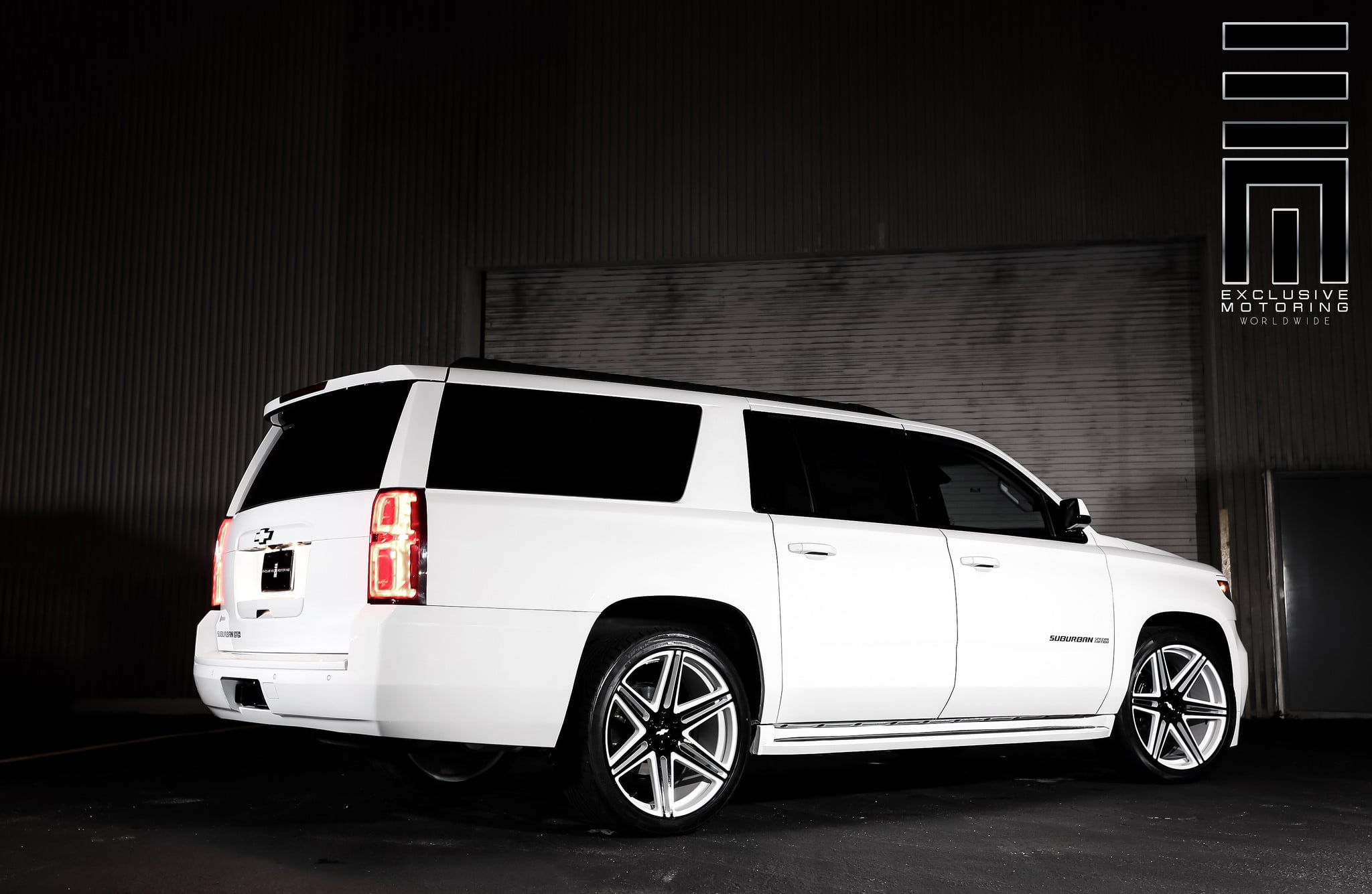 White Custom Chevrolet Suburban - Photo by Exclusive Motoring