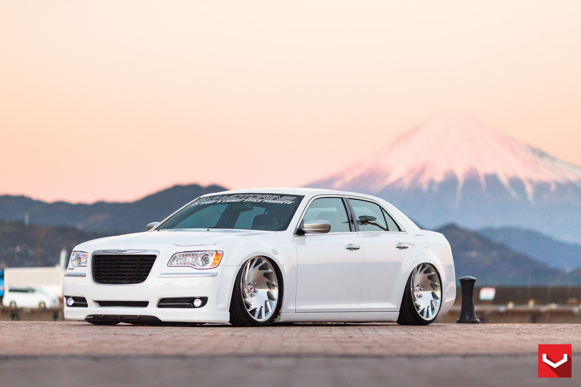 Lowered White Chrysler 300 with Custom Front Bumper Cover - Photo by Vossen