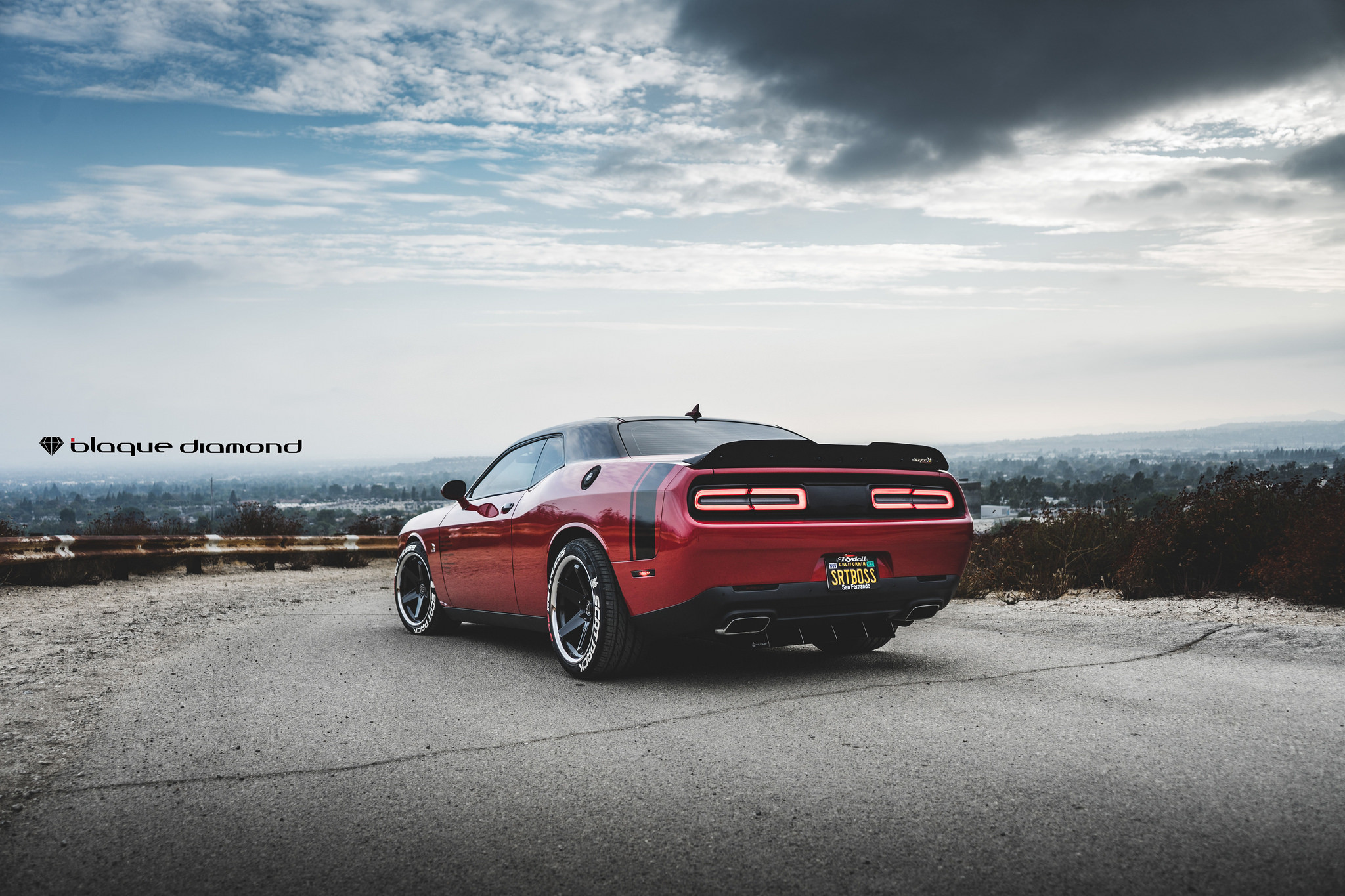 Red Dodge Challenger with Aftermarket Rear Spoiler - Photo by Blaque Diamond