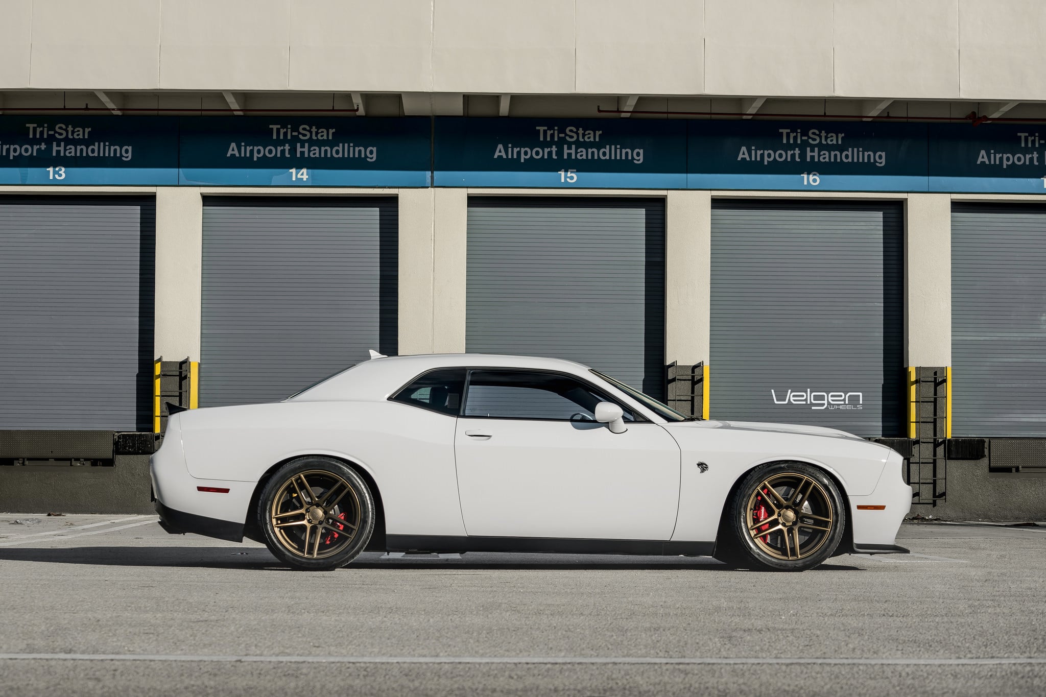 Aftermarket Side Skirts on White Dodge Challenger - Photo by Velgen
