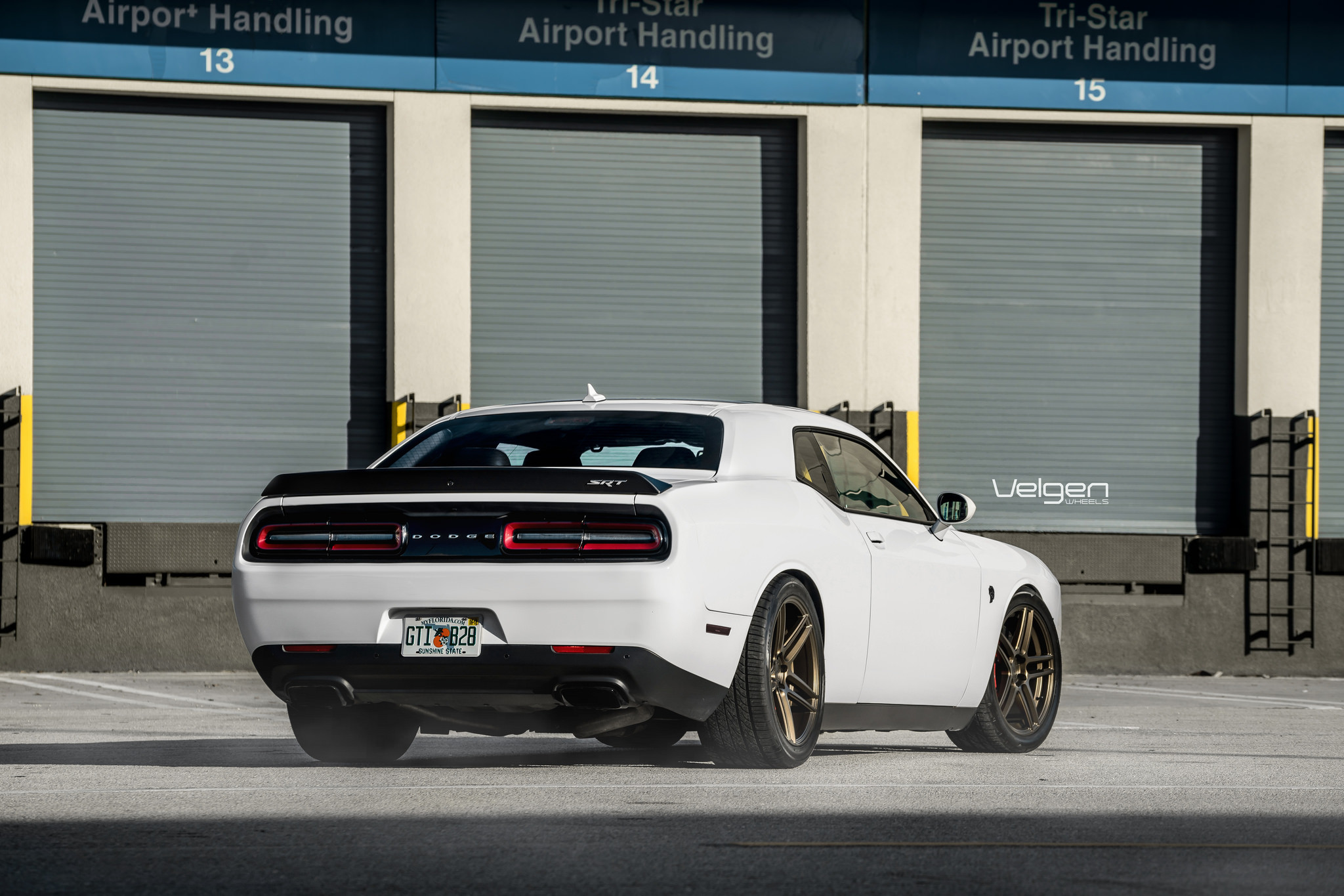 White Dodge Challenger with Custom Style Rear Spoiler - Photo by Velgen