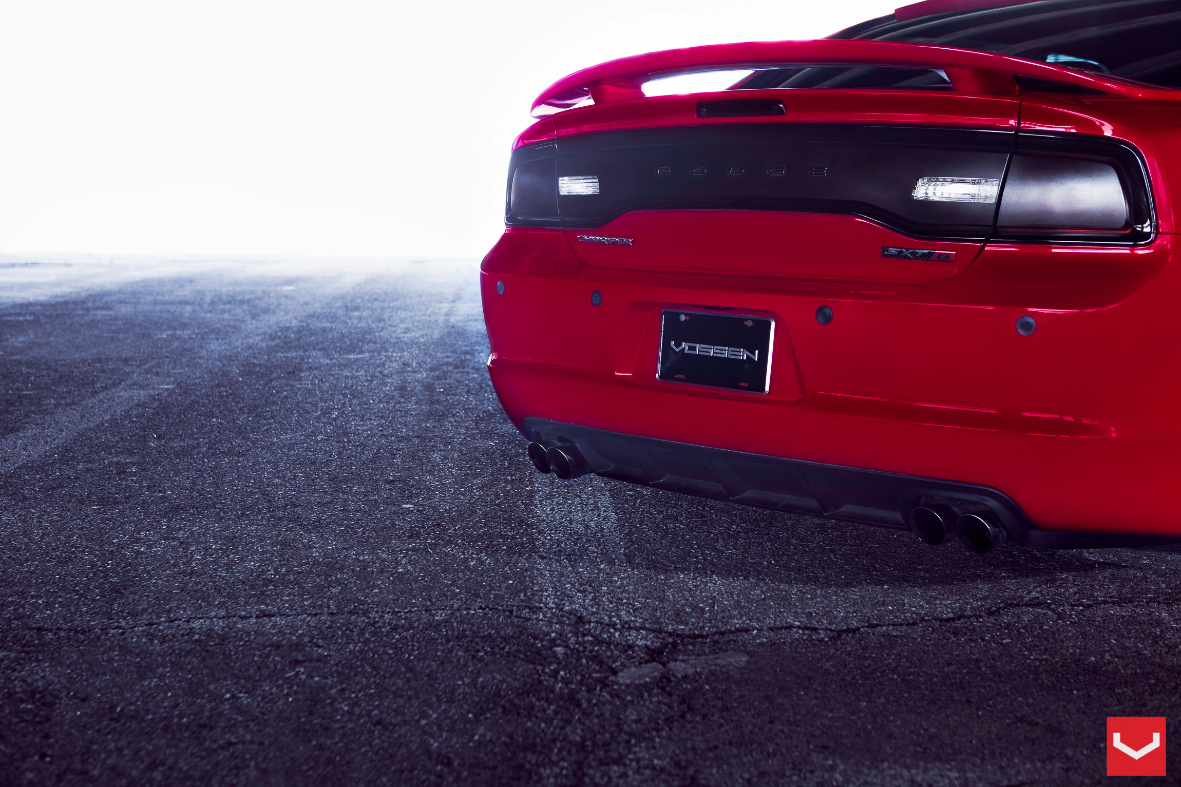 Carbon Fiber Rear Diffuser on Red Dodge Charger - Photo by Vossen