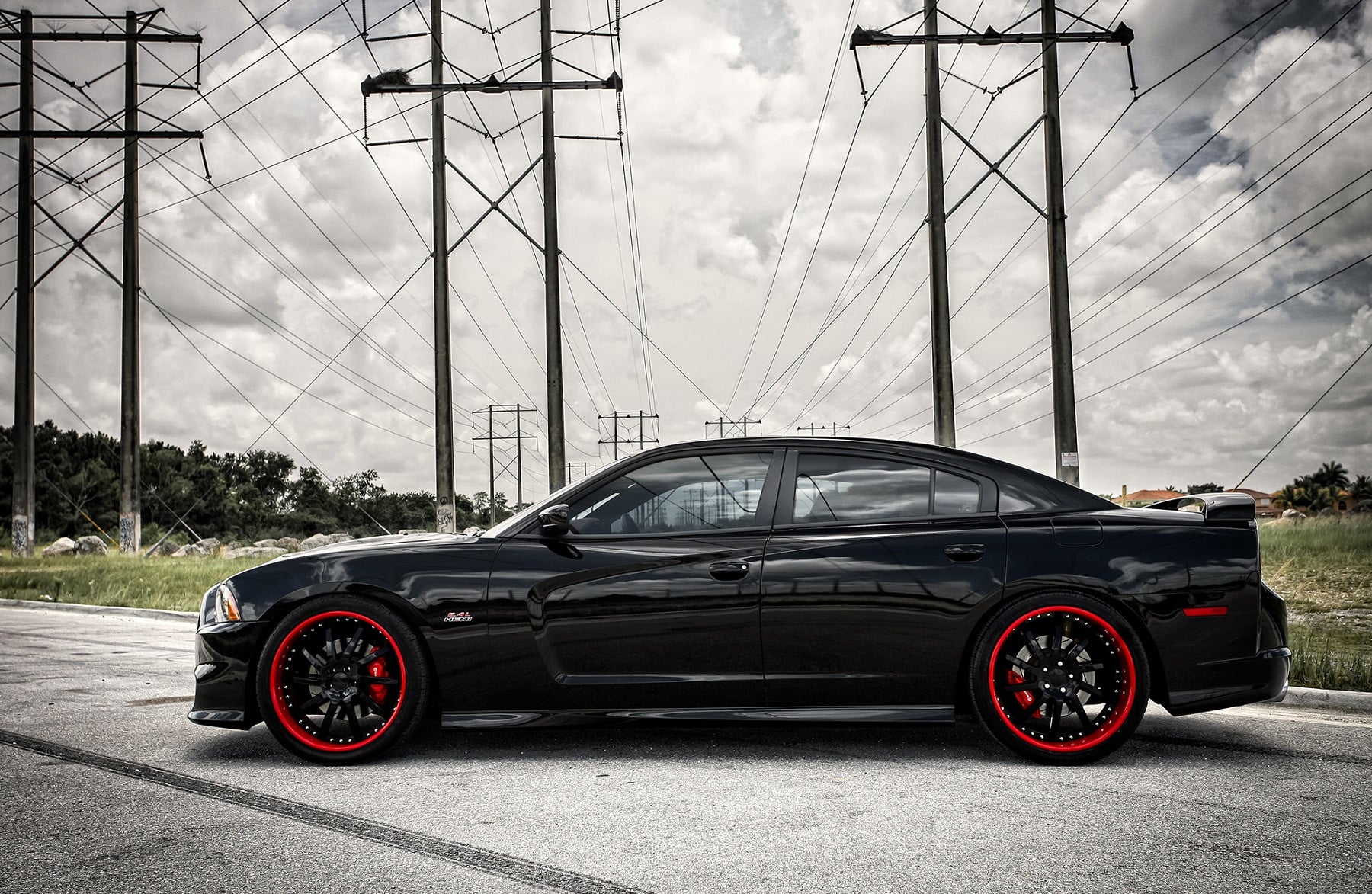 Black rims with Red Lips on Dodge Charger - Photo by Vossen