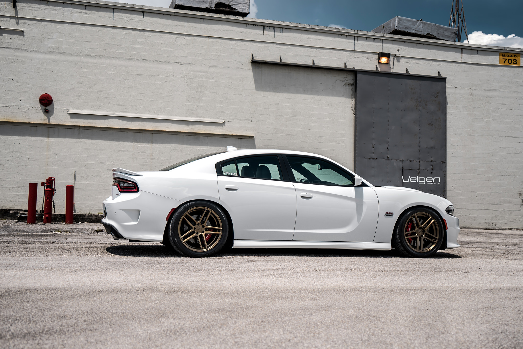 Aftermarket Side Skirts on White Dodge Charger - Photo by Velgen