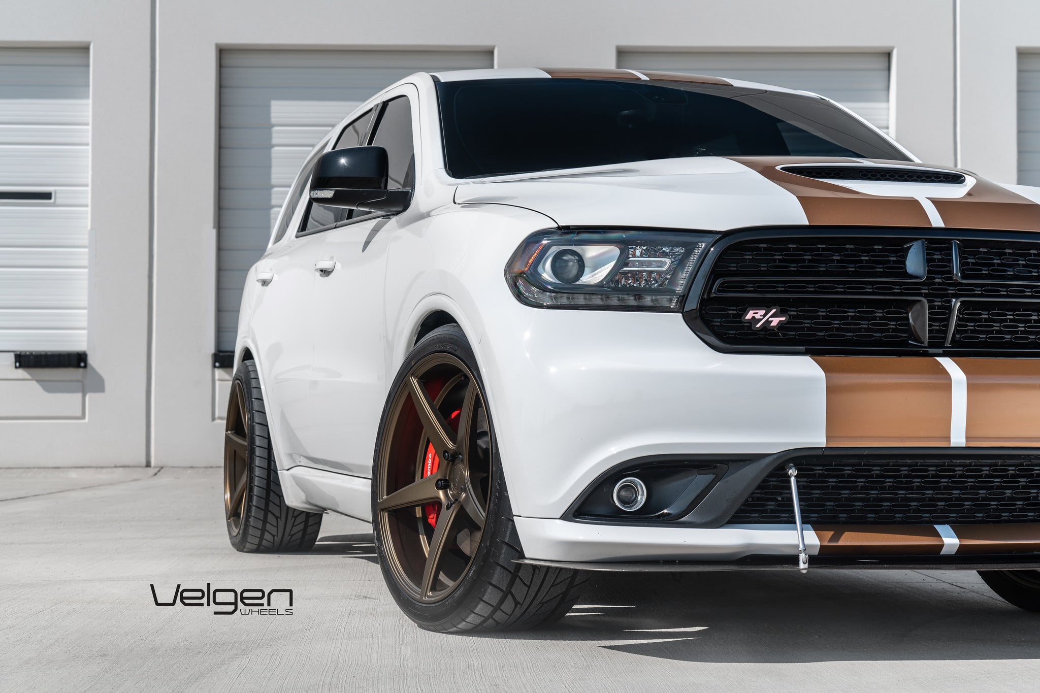 White Dodge Durango with Custom Projector Headlights - Photo by Velgen
