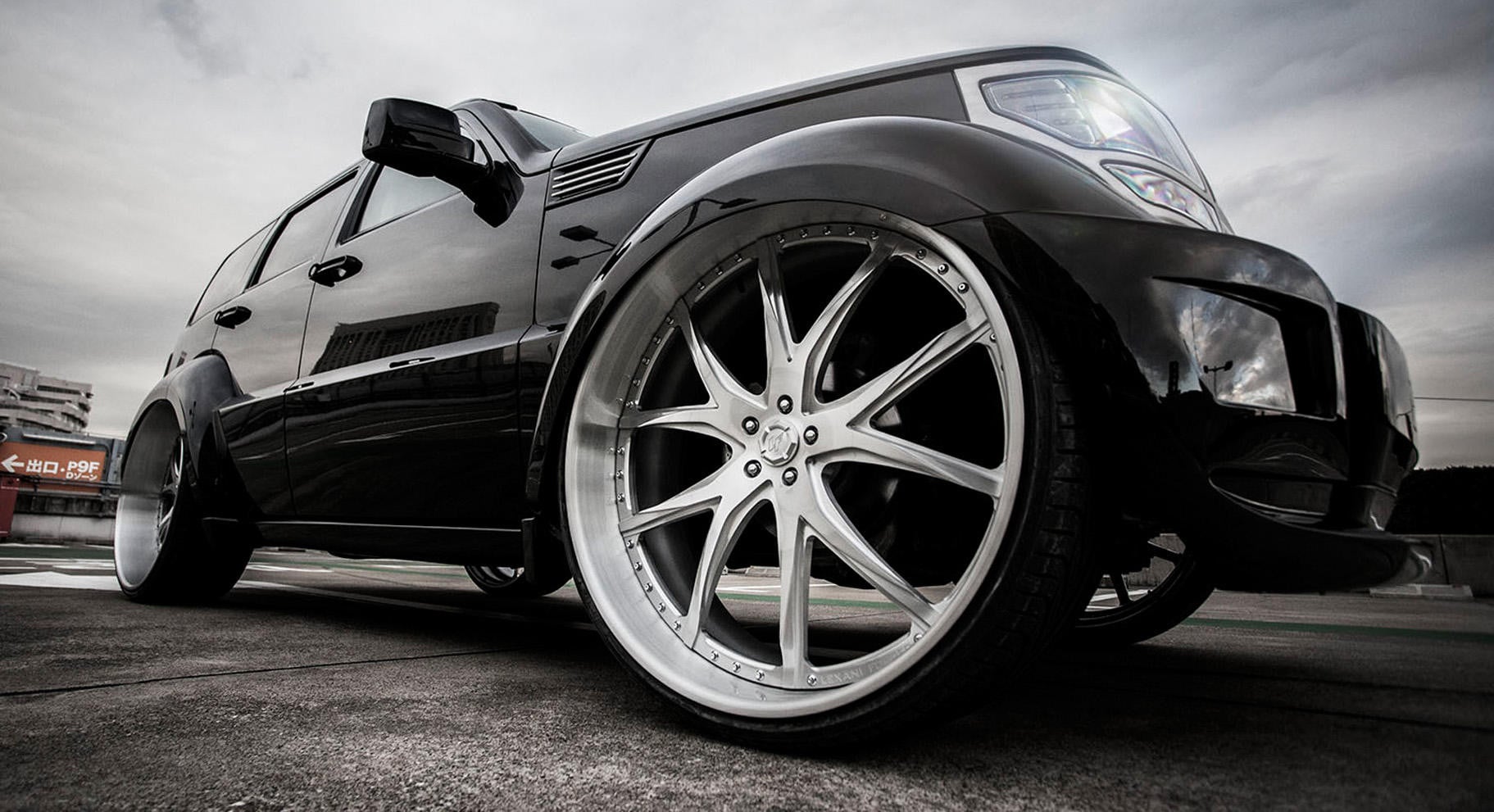Black Dodge Nitro on Custom Brushed Lexani Rims - Photo by Lexani