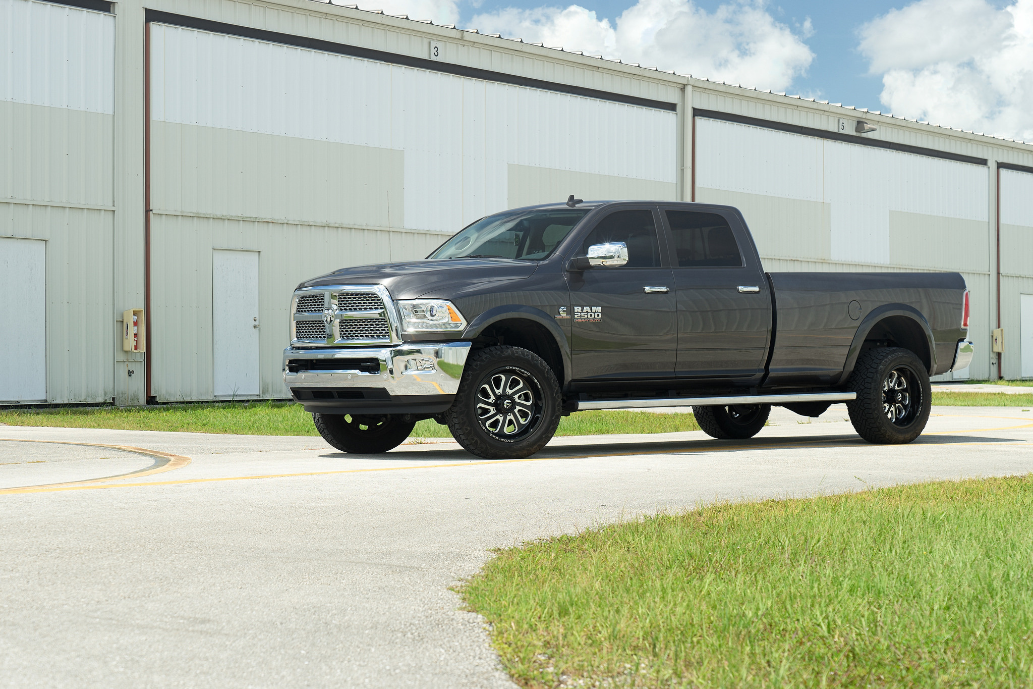 Aftermarket Running Boards on Black Dodge Ram 2500 - Photo by Fuel Offroad