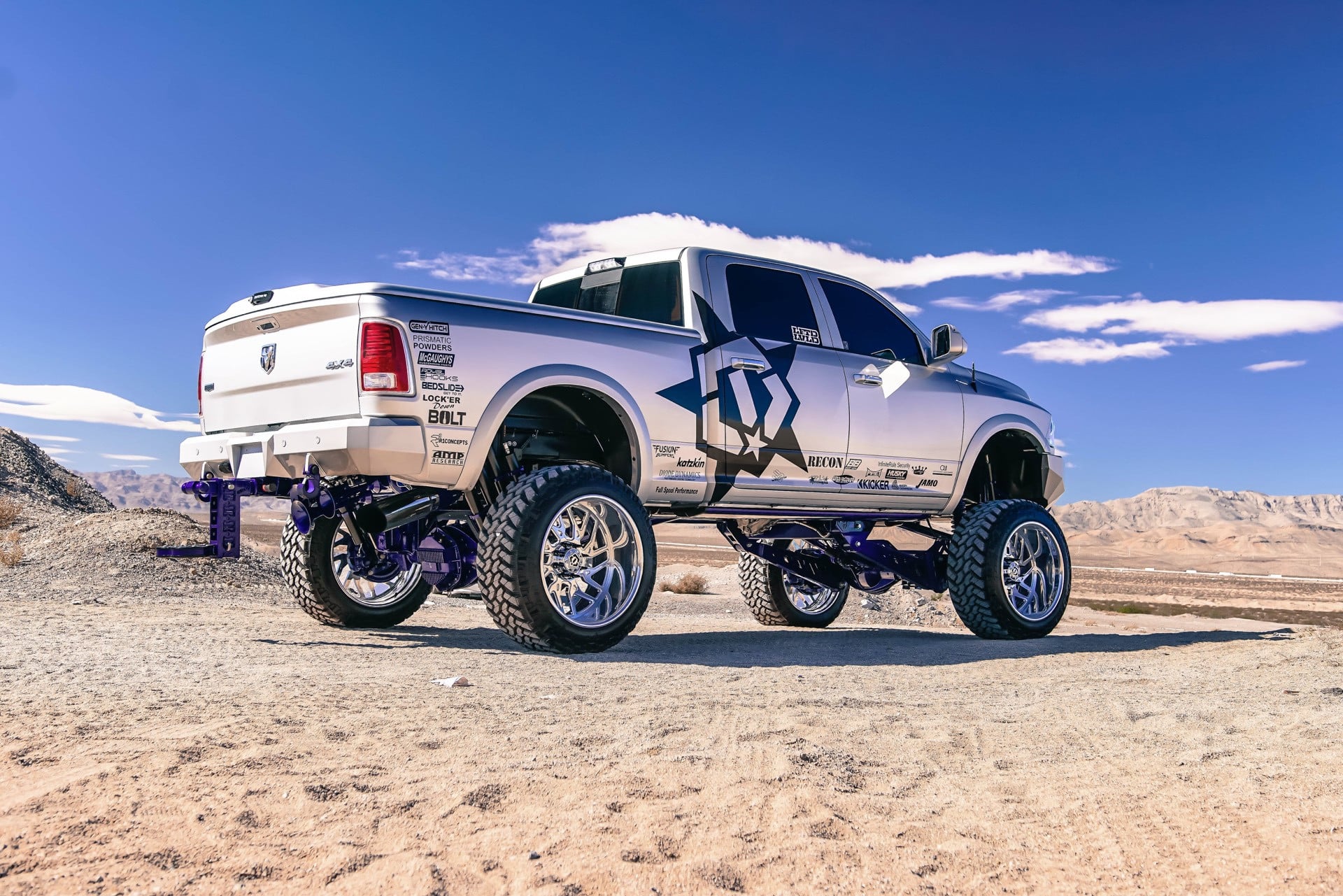 AMP Research Running Boards on Silver Lifted Dodge Ram - Photo by TIS Wheels
