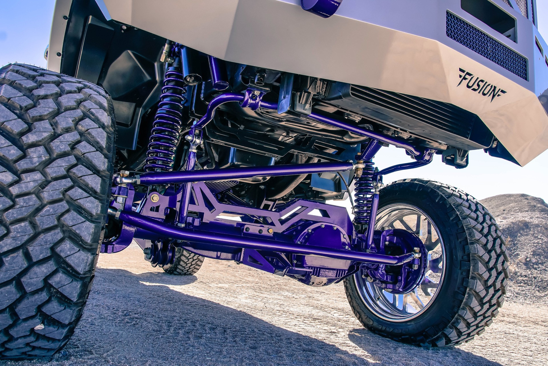 Silver Lifted Dodge Ram with McGaughy Suspension Kit - Photo by TIS Wheels