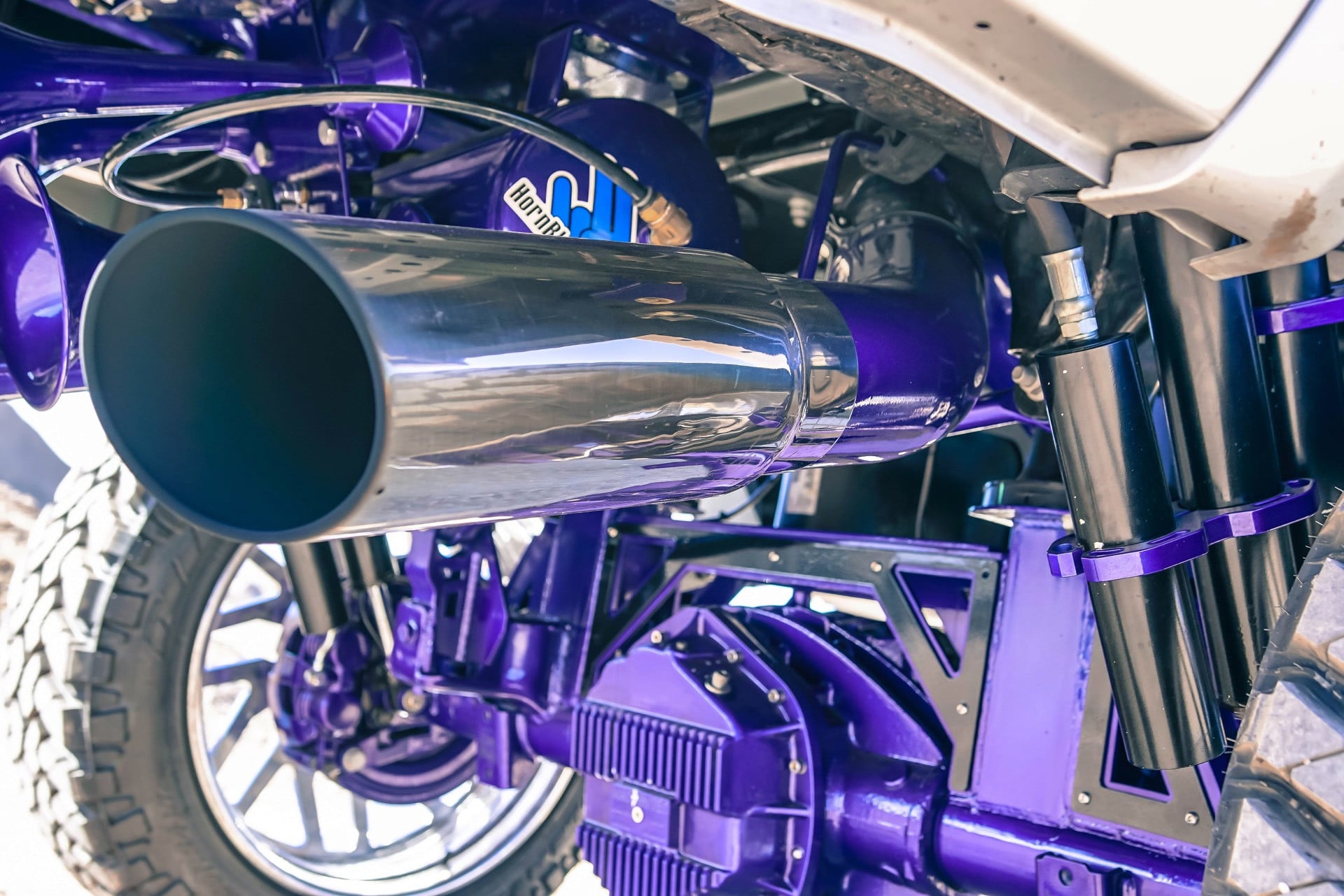 Silver Lifted Dodge Ram with Custom Exhaust System - Photo by TIS Wheels